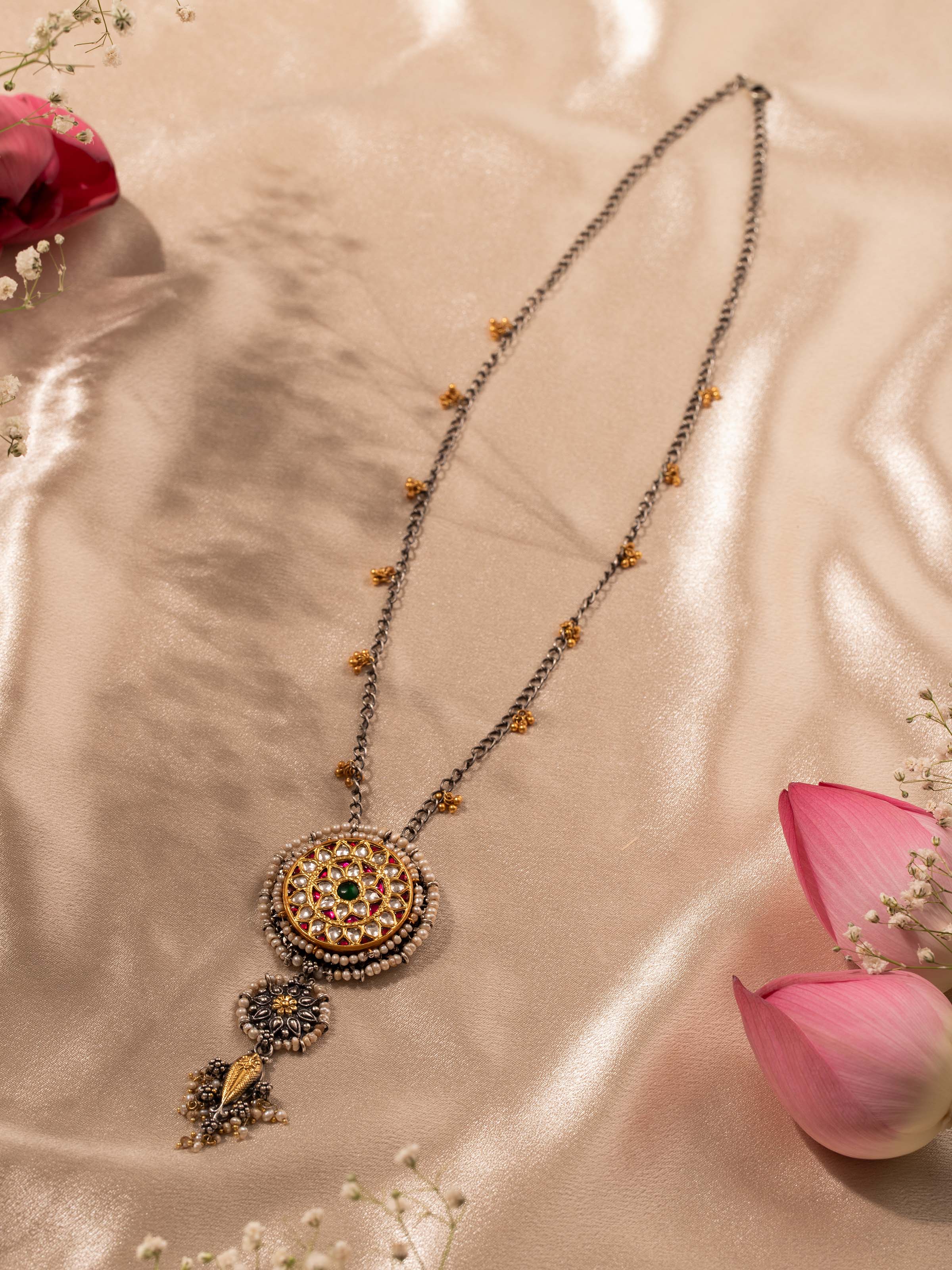 Angled view of Silver Smithing Pendant & Chain highlighting its elegant design and silver detailing.