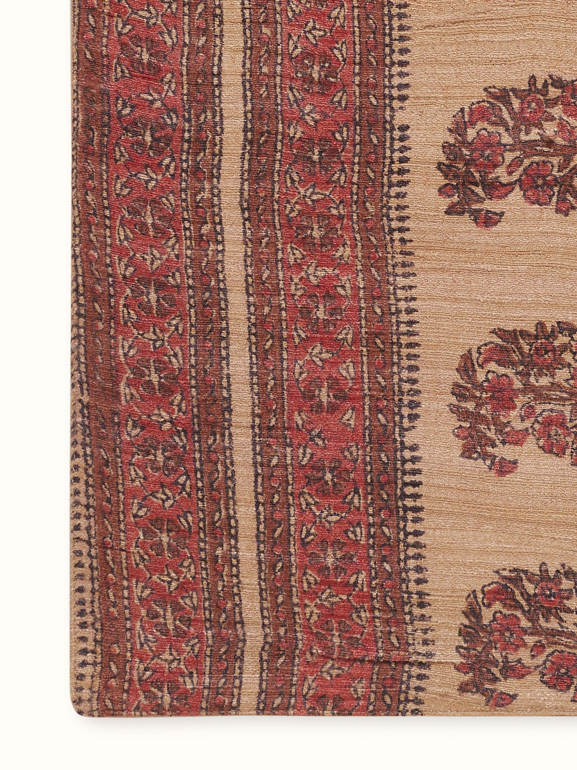 Close-up detail showing texture and weave of tussar silk with rust-toned Bagru motifs
