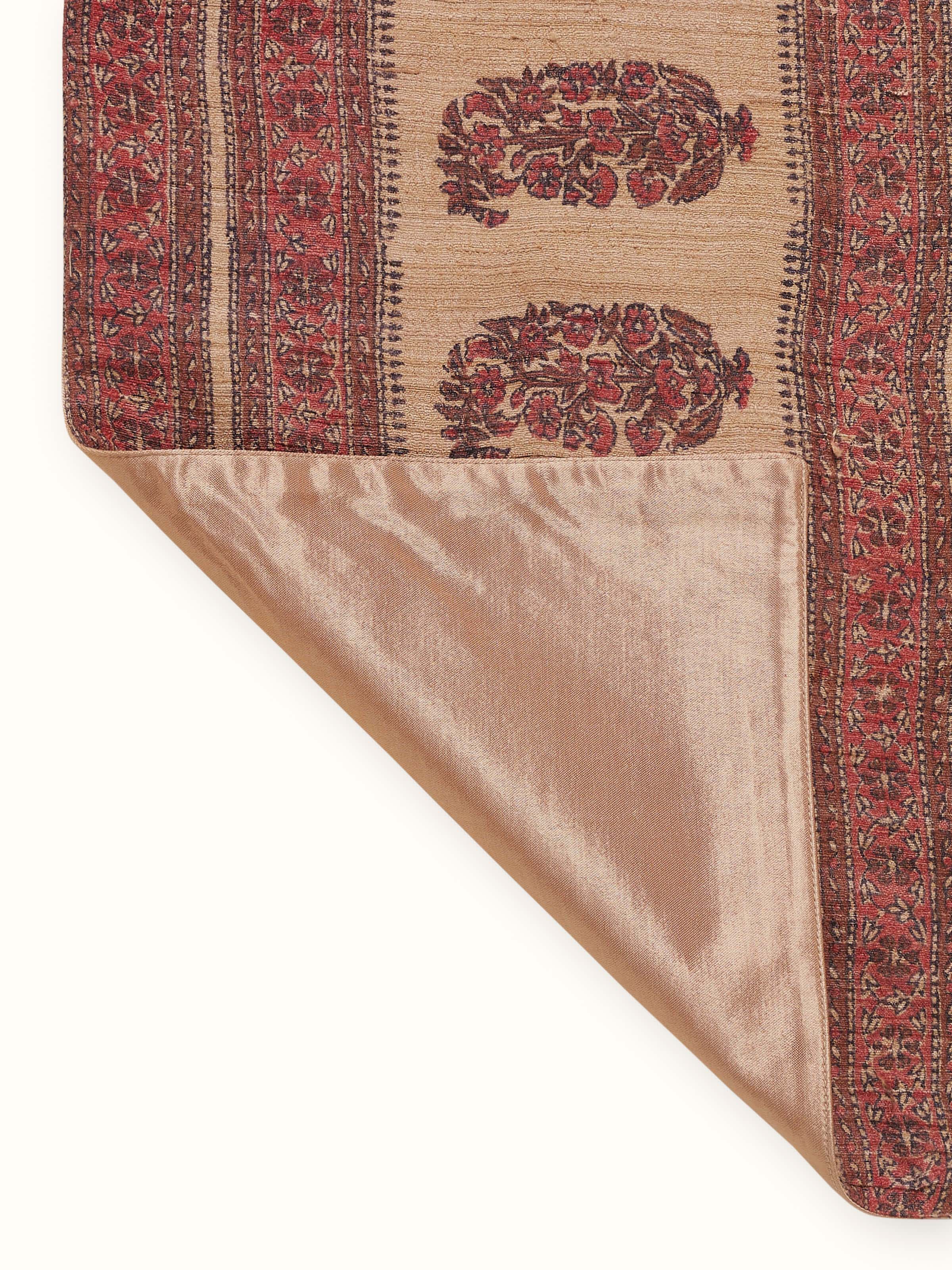 Back view of Vasudha rust paisley table runner with neat finish and border detailing
