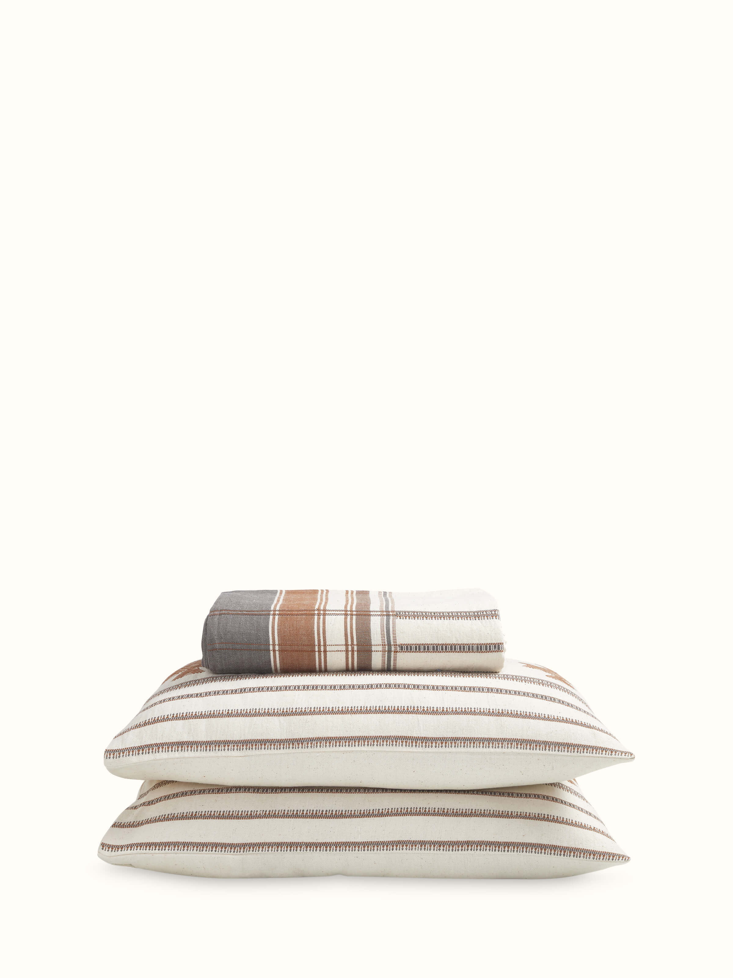 Angled view of Adalaj brown geometric cotton Bhujodi extra-weft queen bedspread set (3 pcs) showing its geometric pattern and color.