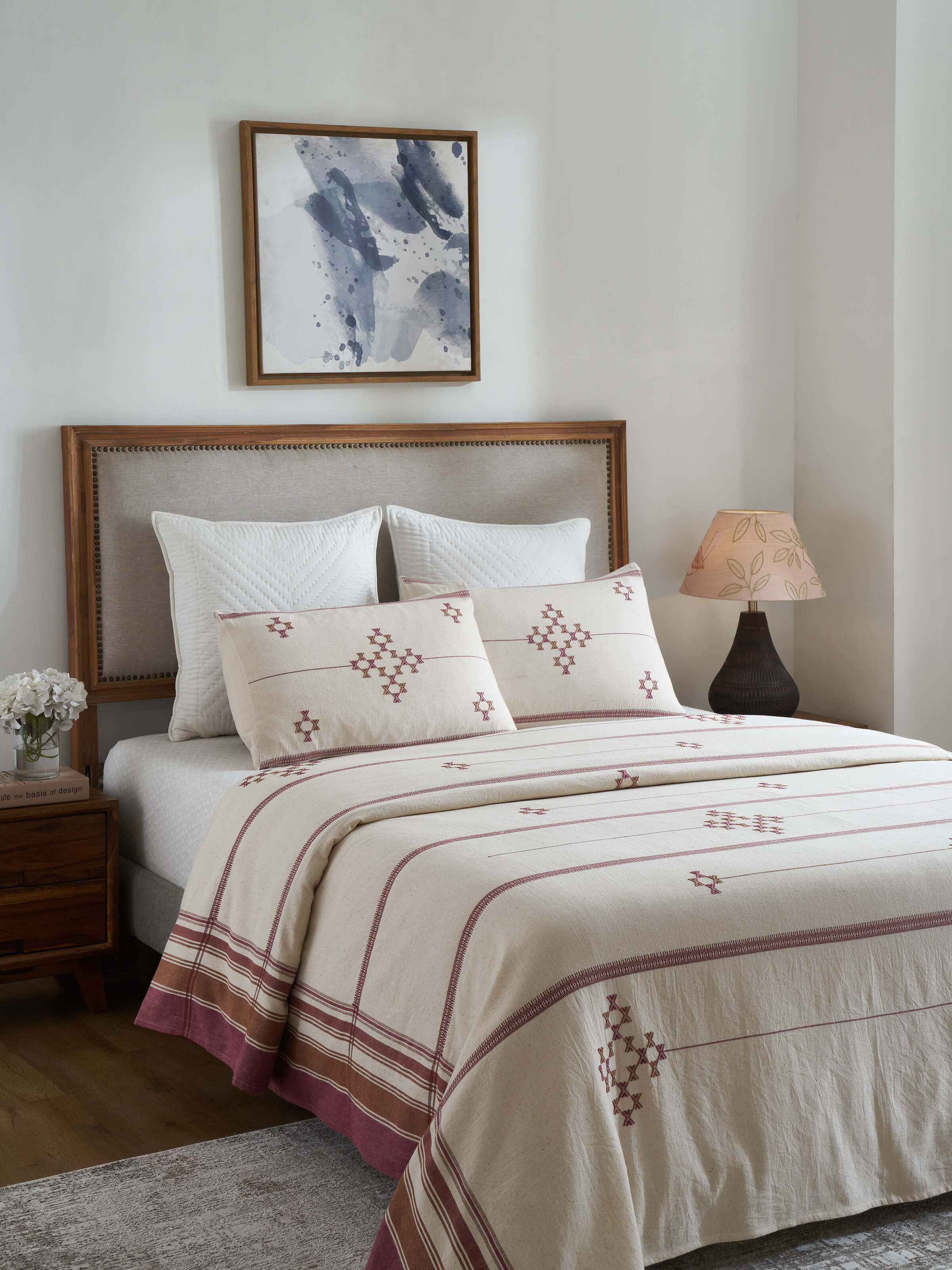 Close-up of Adalaj pink geometric cotton Bhujodi bedspread highlighting the detailed pattern