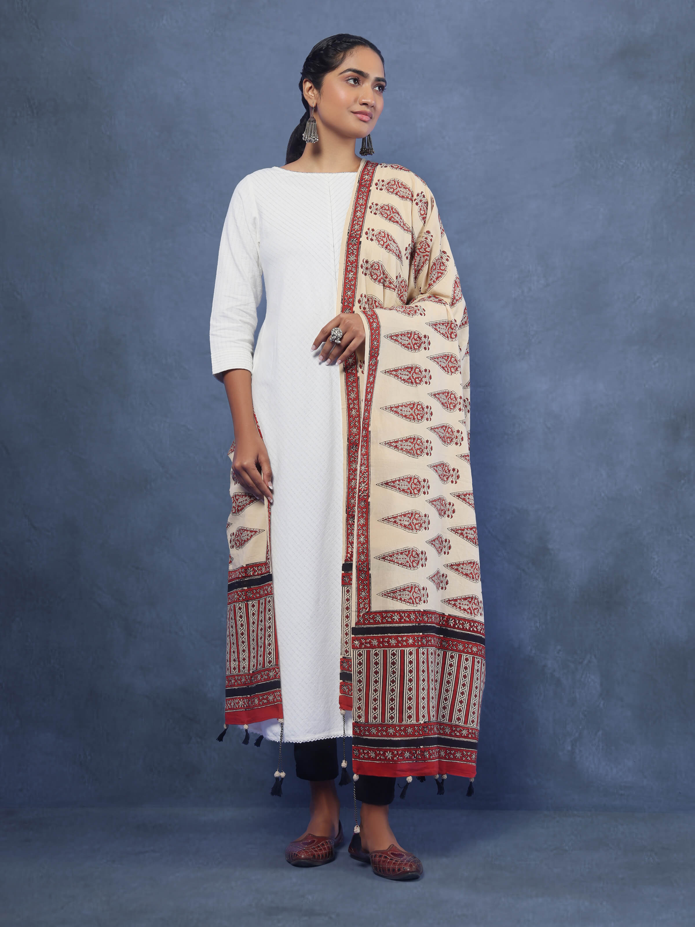 Lifestyle image of off-white cotton Bagru block printed dupatta styled over ethnic wear.