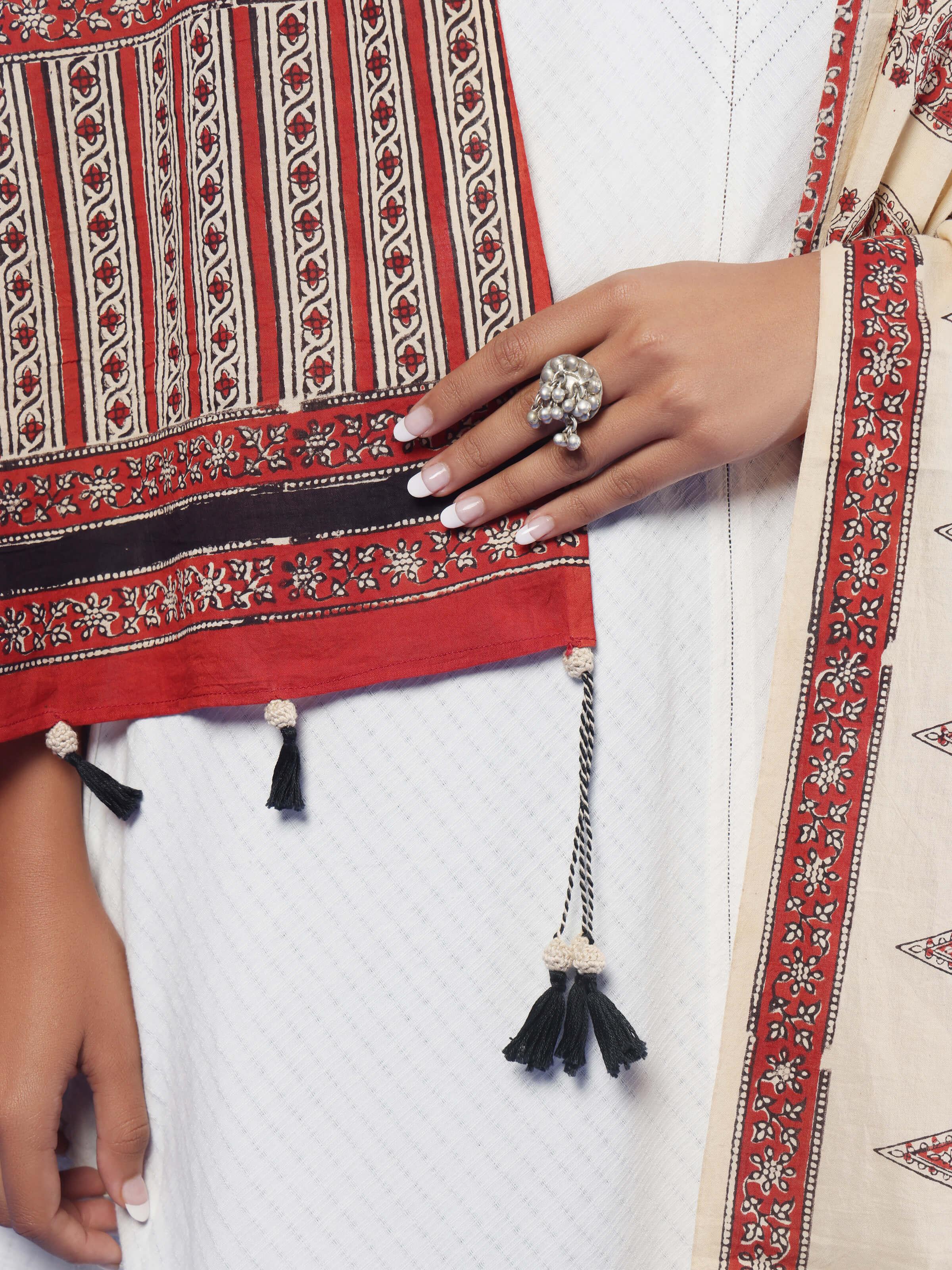 Angled view of off-white cotton Bagru block printed dupatta showcasing natural dyes and print details.