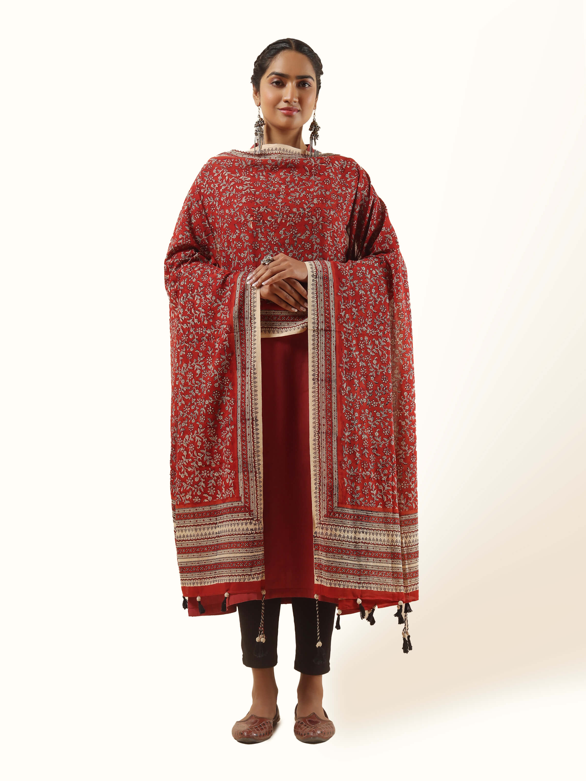Front view of red and beige cotton Bagru block printed dupatta with floral and geometric motifs.