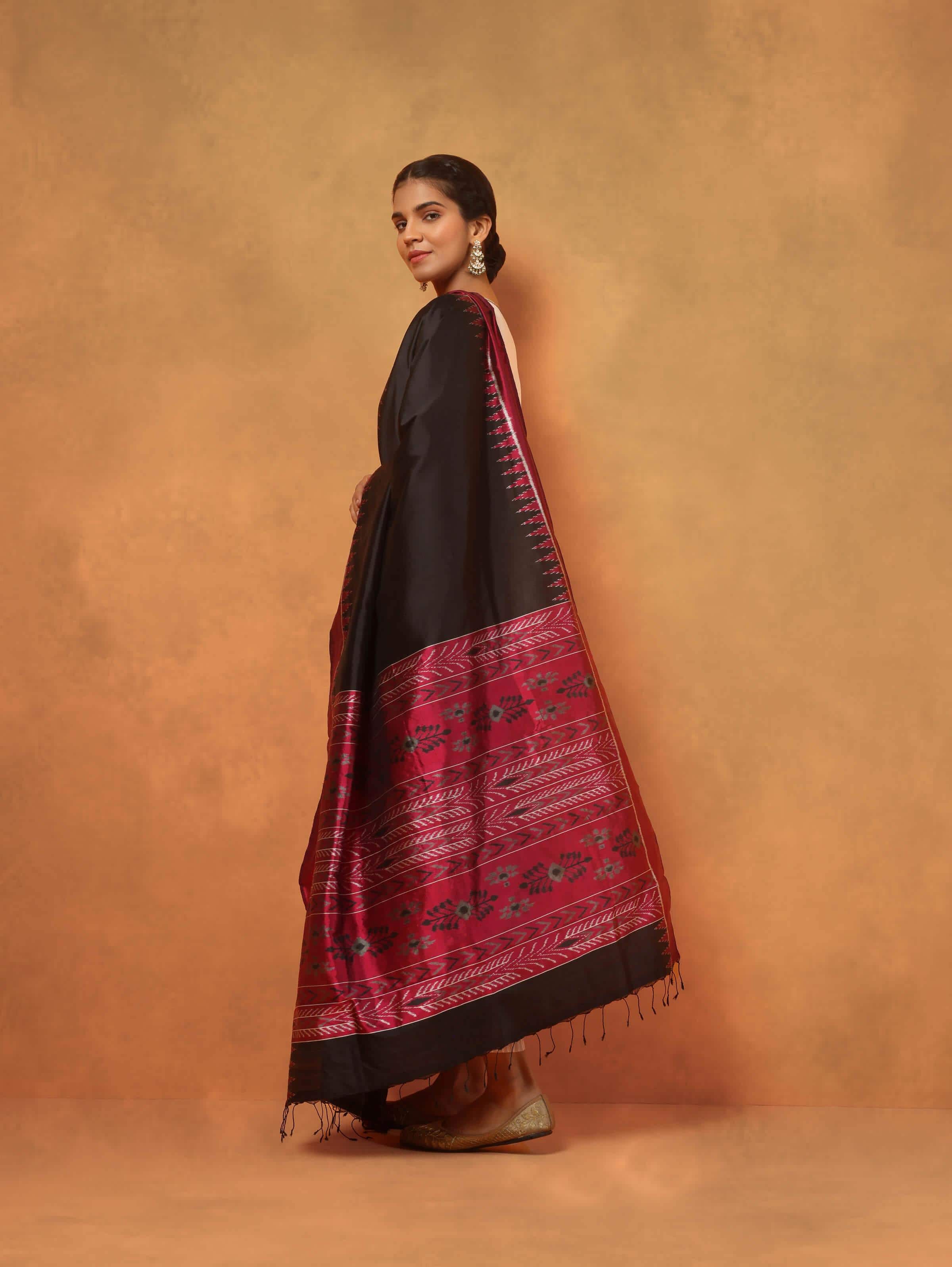 Pink and black silk Odisha Ikat dupatta angled view highlighting Ikat design and fabric flow