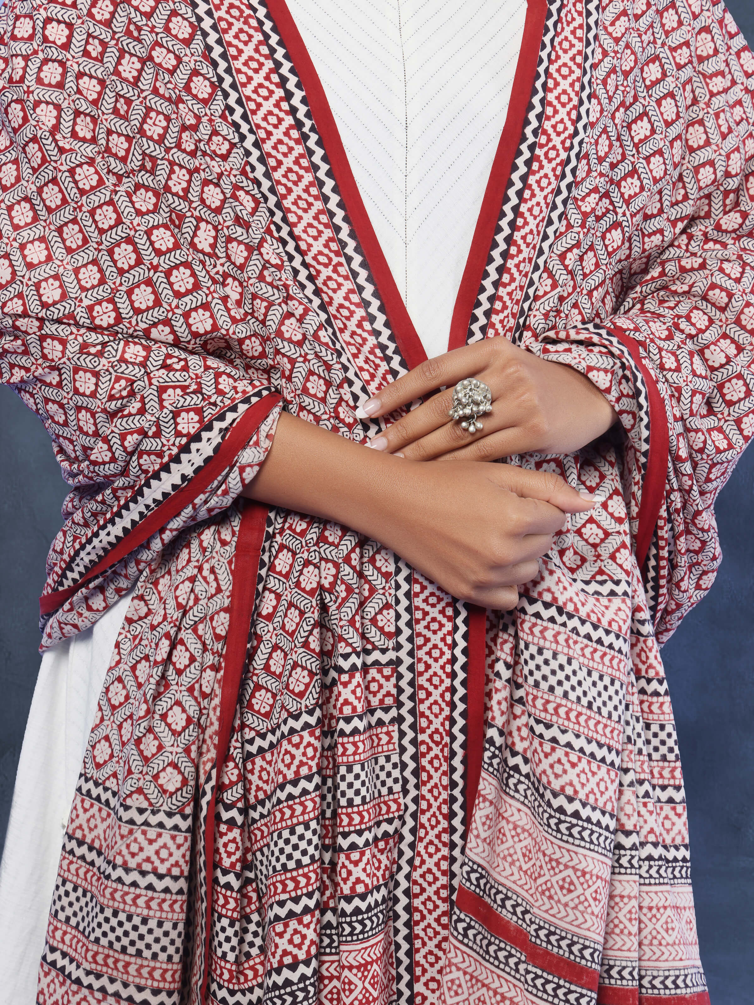 Detail shot of Bagh block print on red cotton dupatta highlighting hand-printed detailing