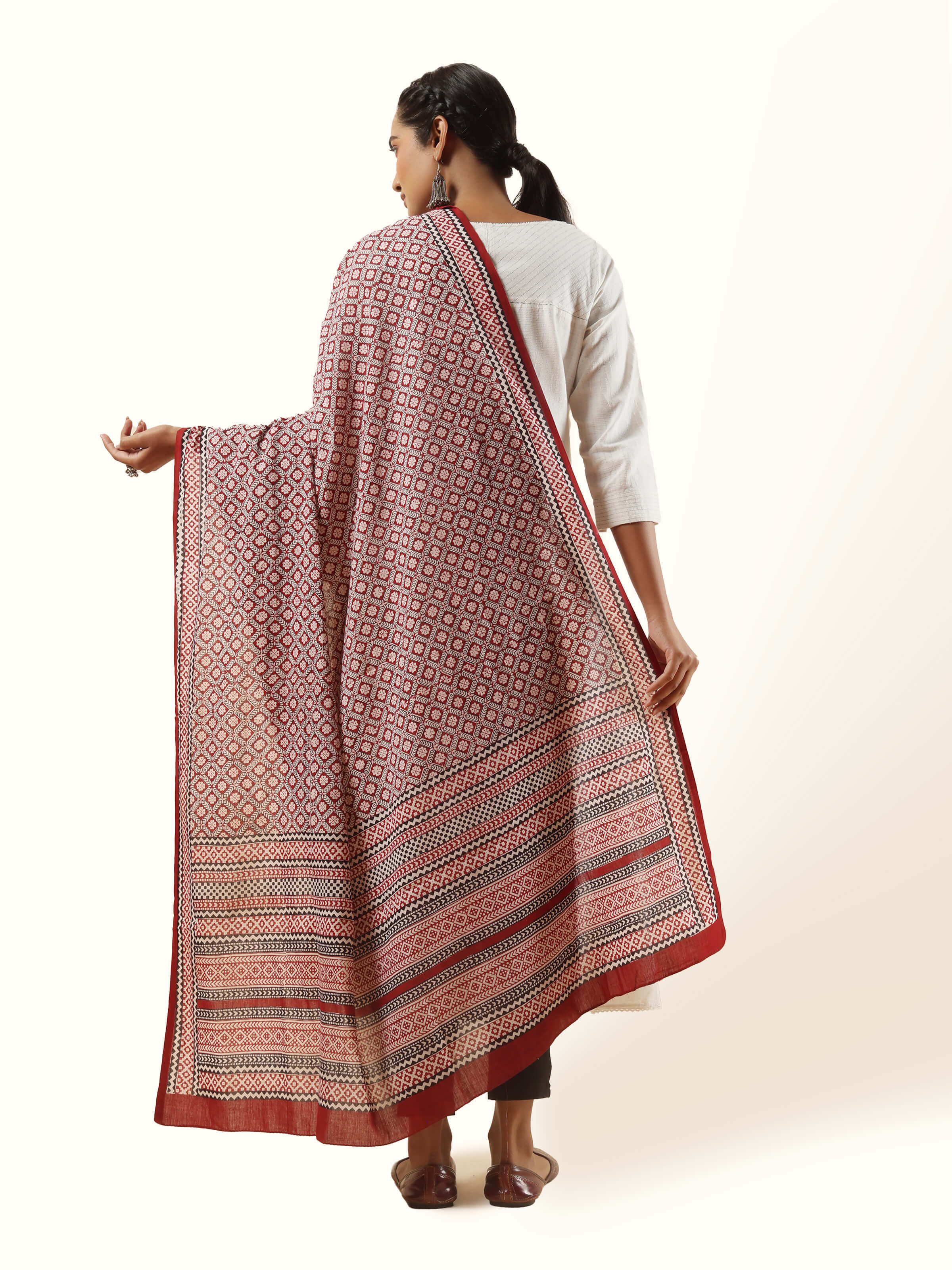 Back view of red cotton Bagh dupatta displaying print layout and fabric flow
