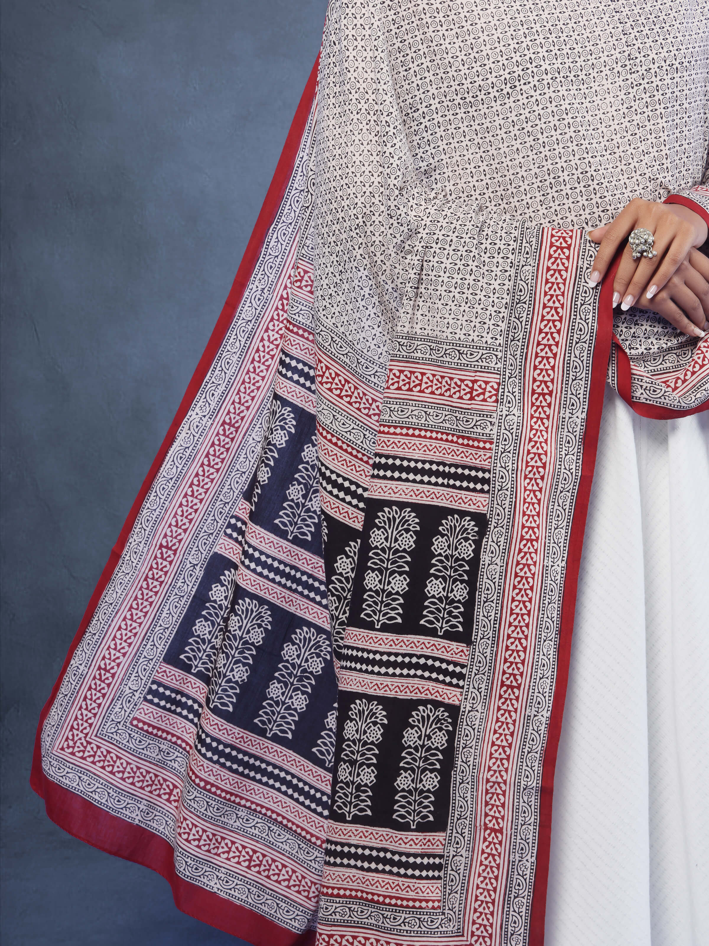 Displayed on a stand, emphasizing the full length and pattern of the cotton stole.