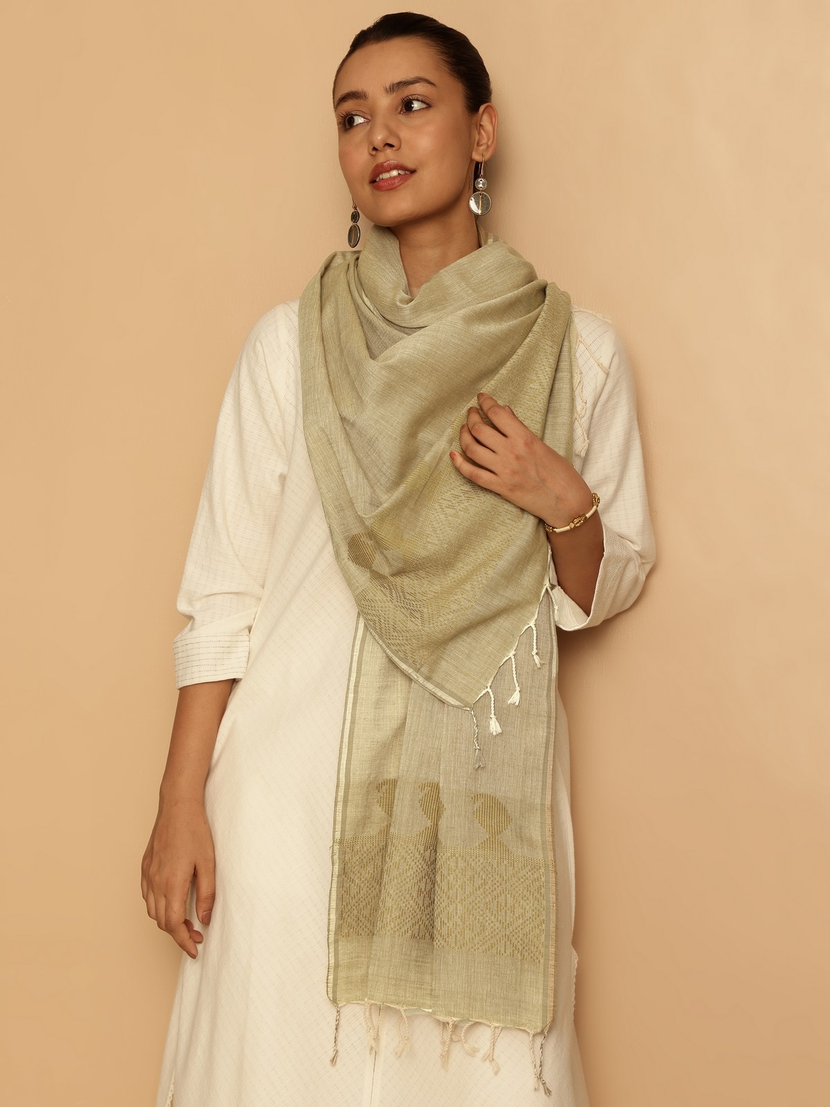 Close-up side view showing detailed weaving and soft fabric texture of yellow cotton extra-weft stole.