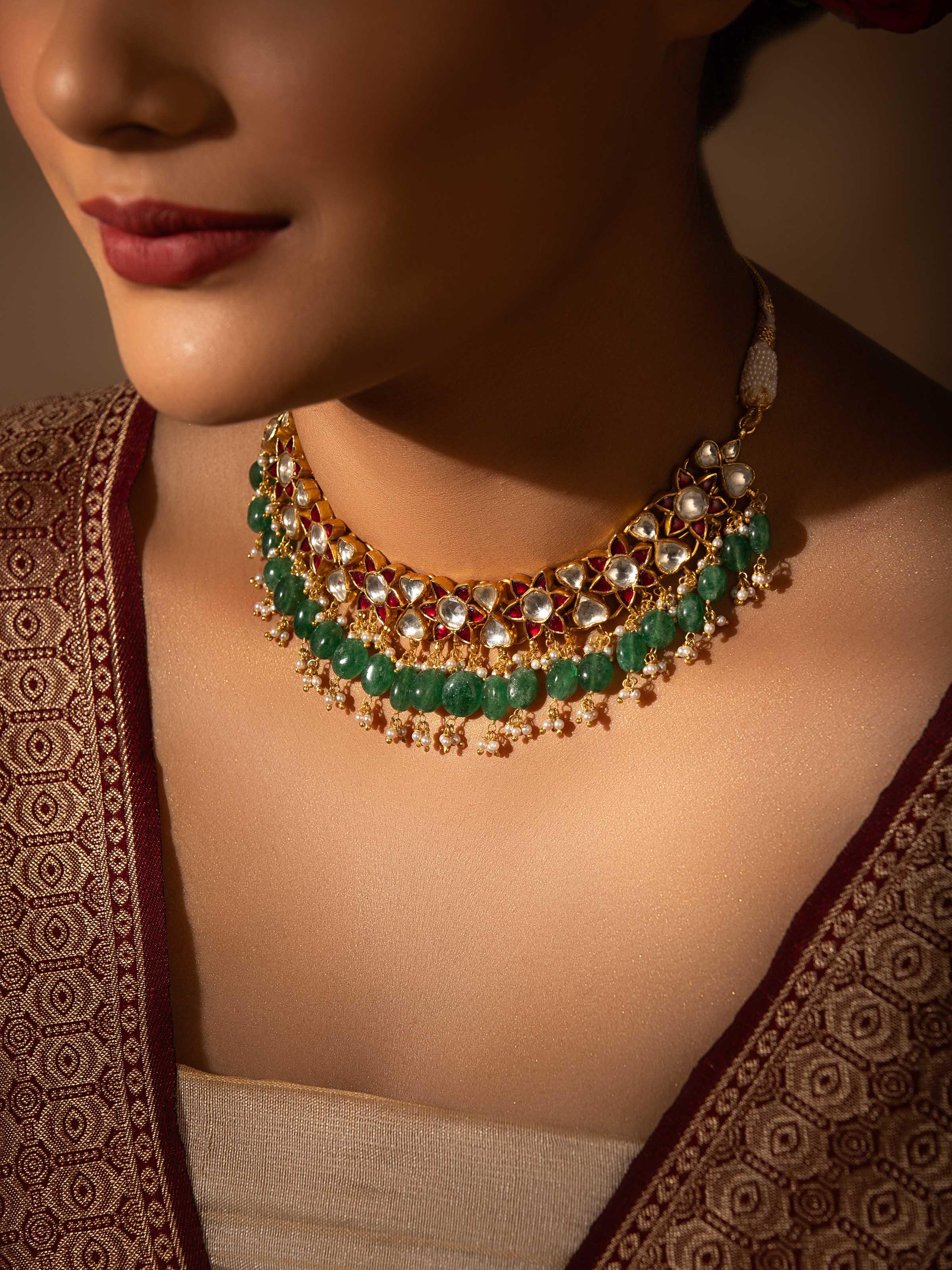 Angled view of Silver Smithing Collar Necklace highlighting the intricate silverwork and collar shape.