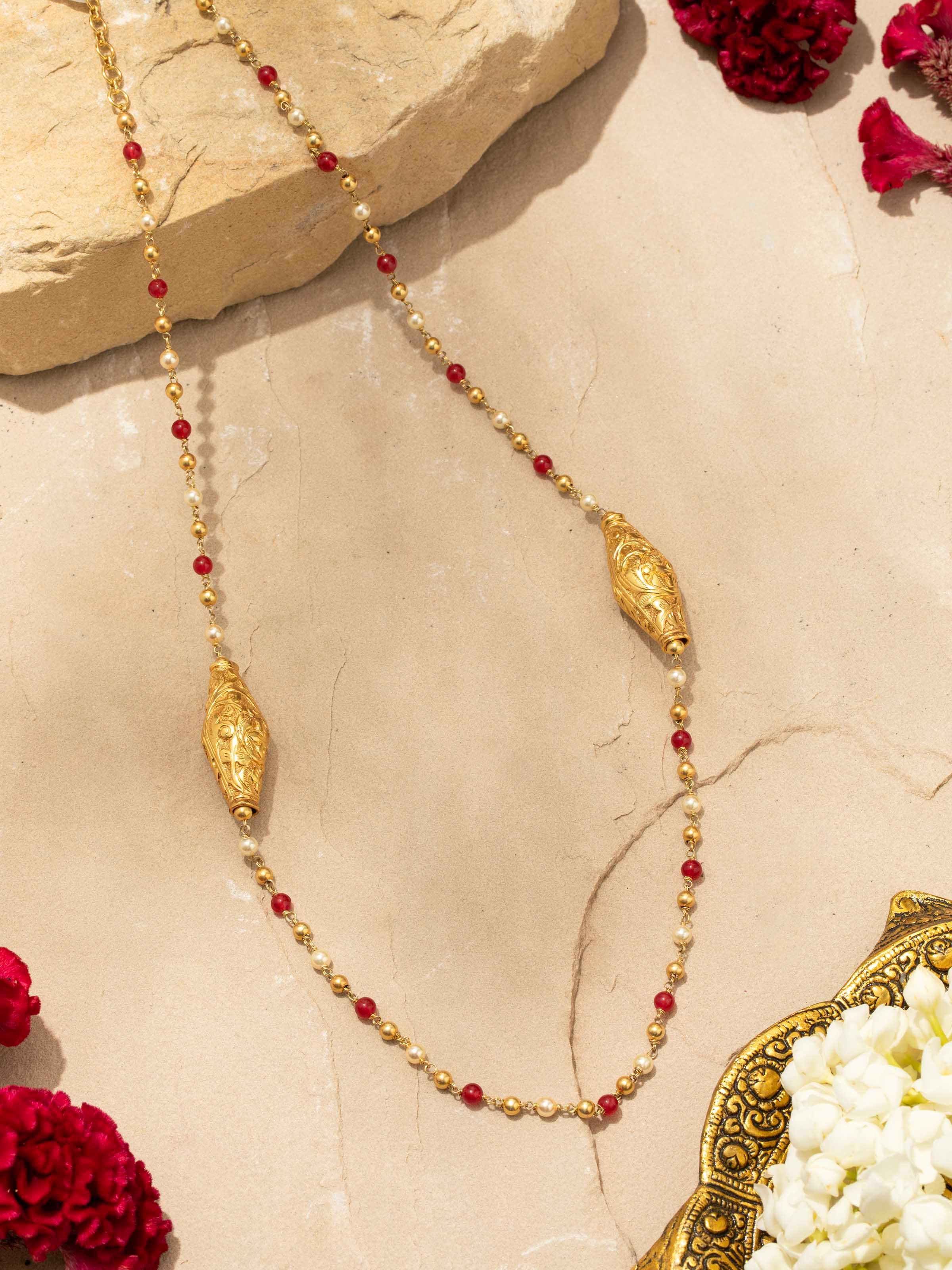 Detailed view of Chitai silver long necklace focusing on the fine craftsmanship and detailed patterns.