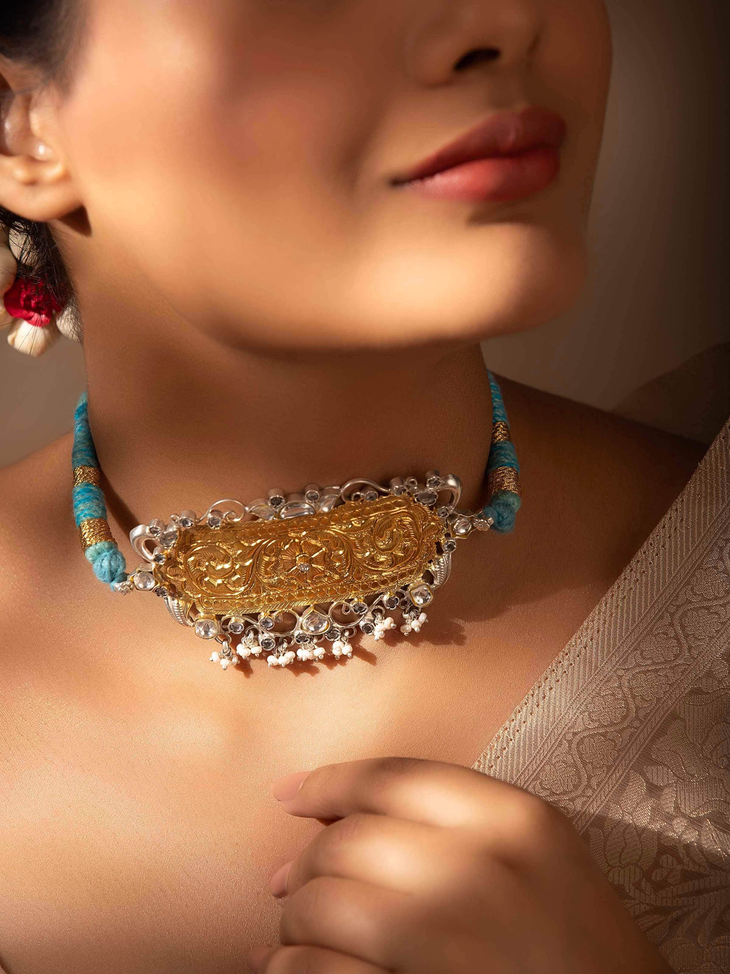Side view of Chitai silver choker highlighting its detailed metalwork and classic design