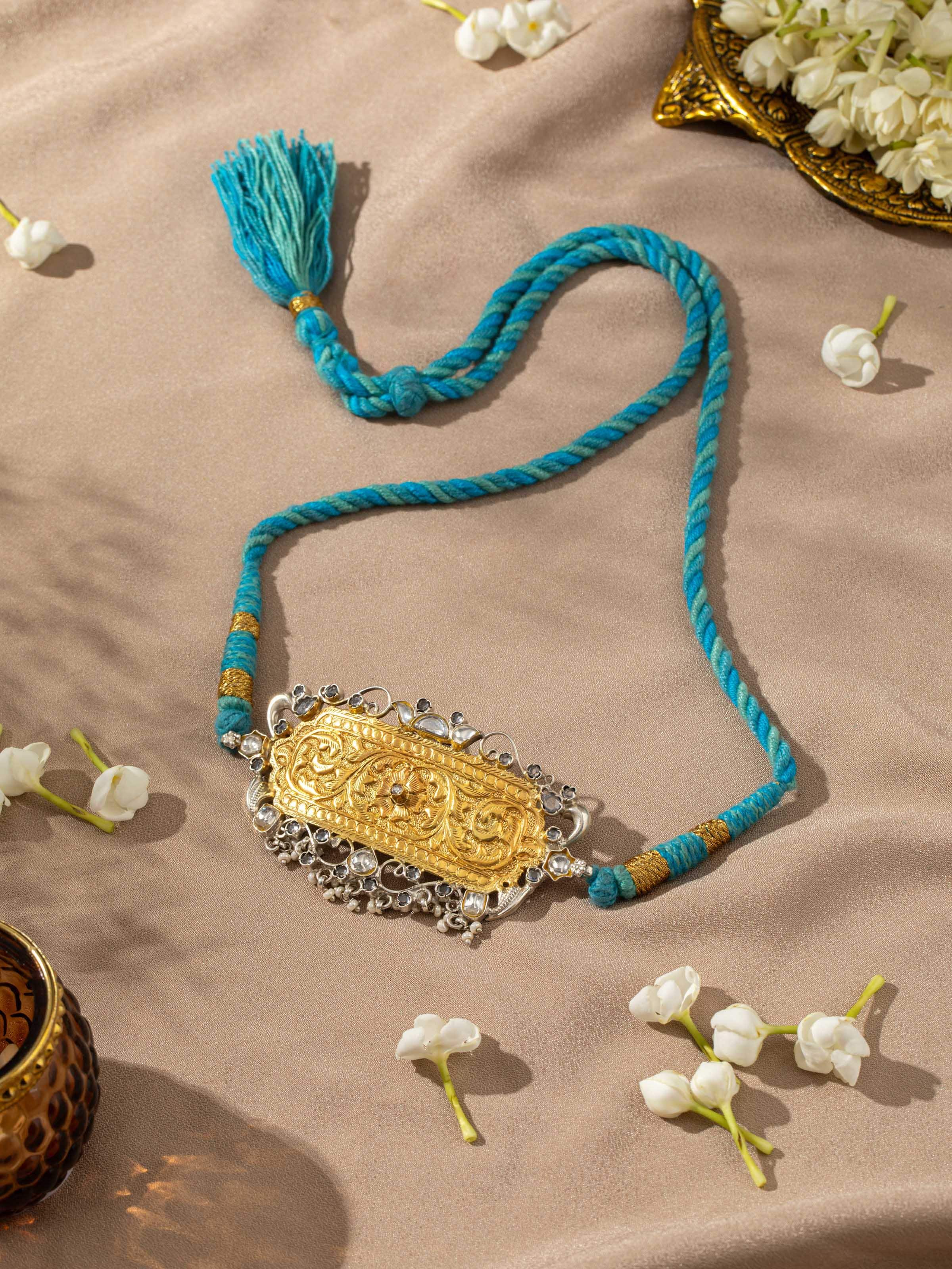 Angled view of Chitai silver choker showcasing its elegant design and detailed metalwork