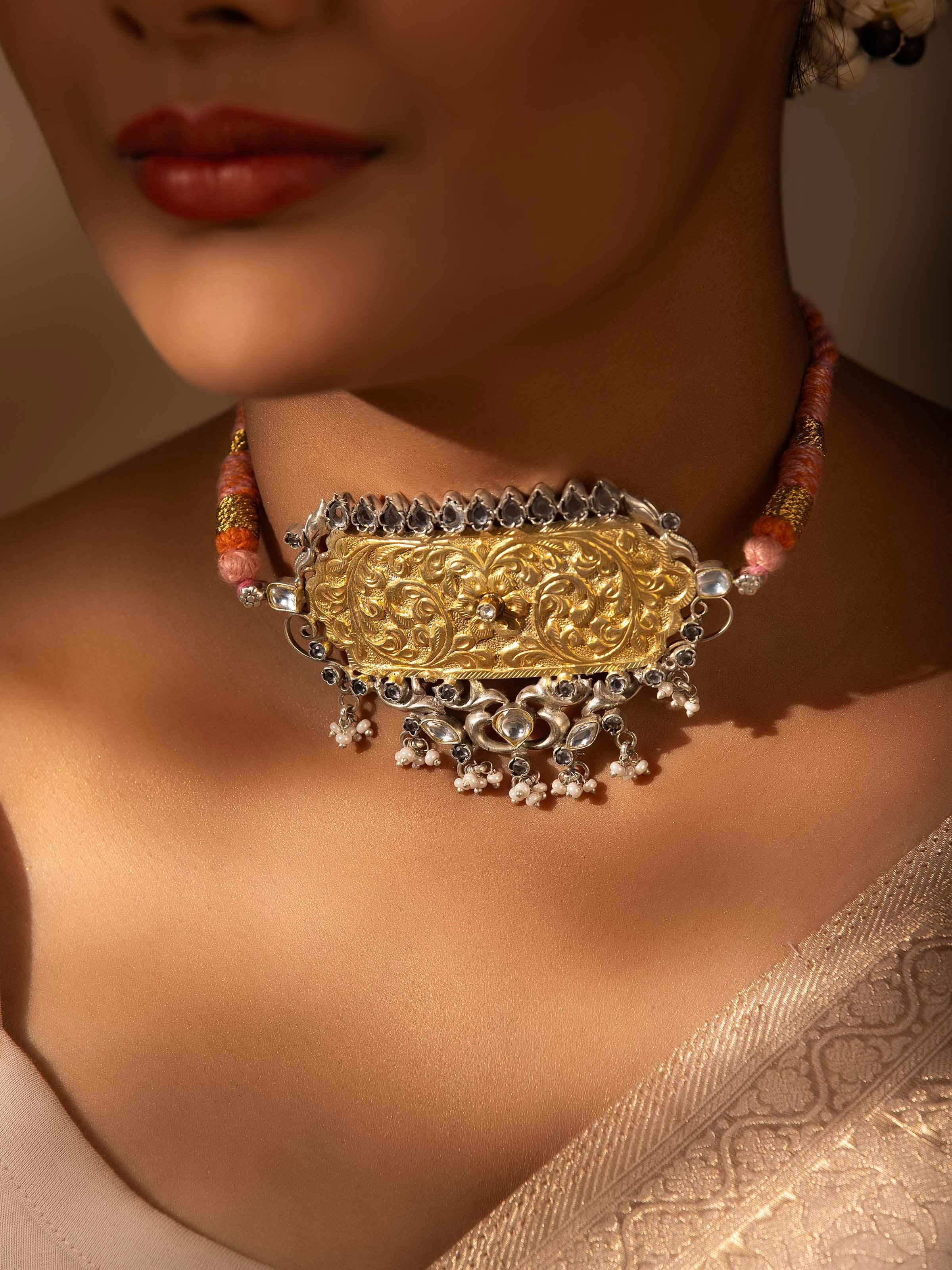 Side view of Chitai silver choker showcasing layered structure and fine detailing