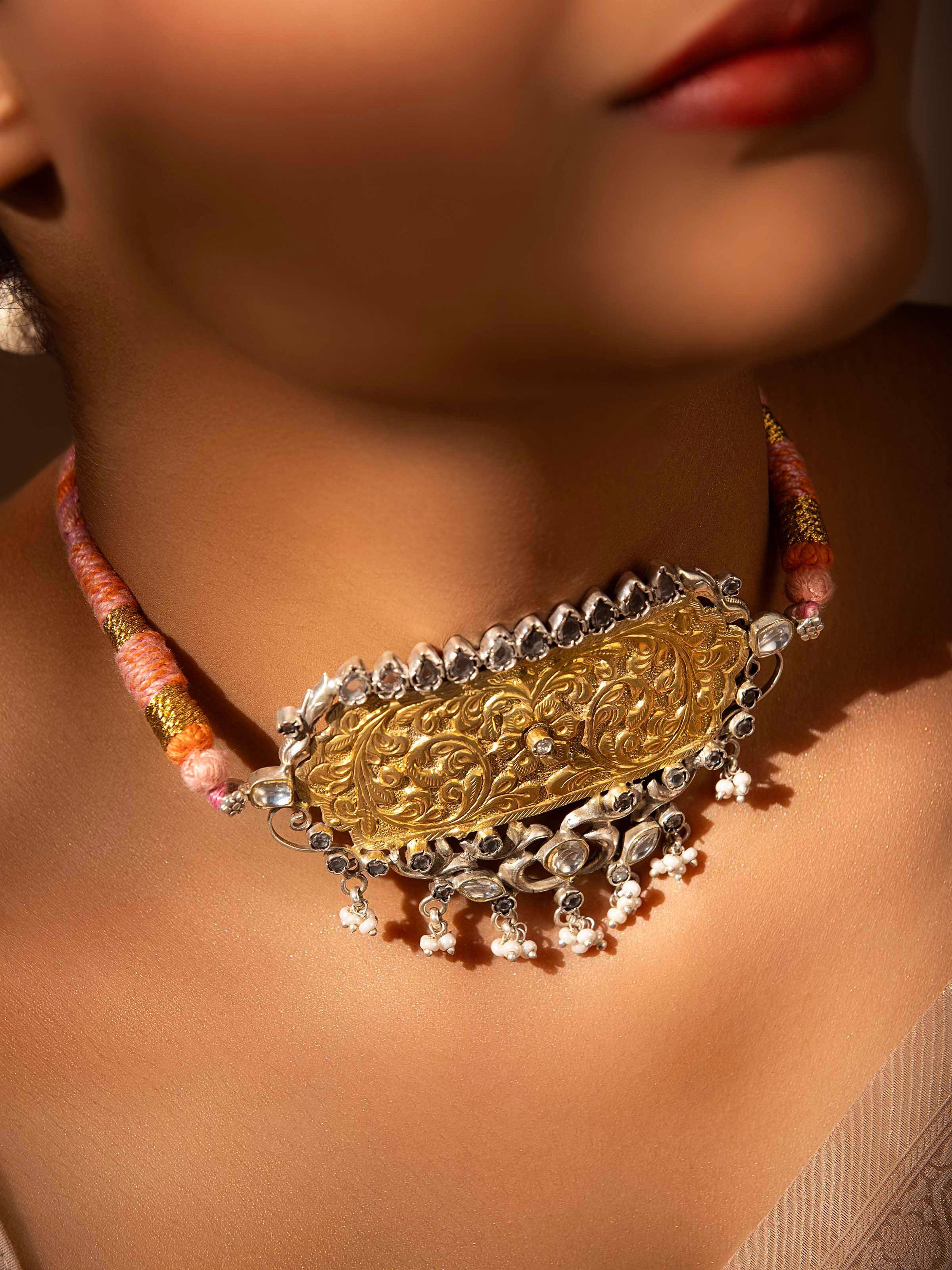 Alternate side view of Chitai silver choker displaying ornamental texture and handcrafted elements