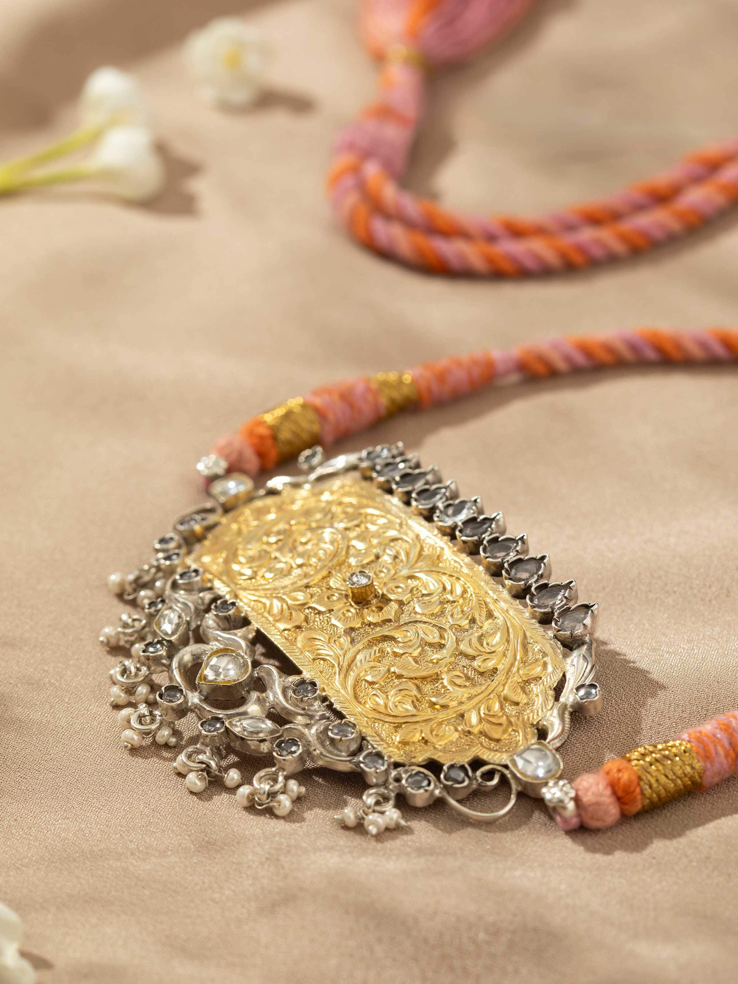 Detailed view of Chitai silver choker emphasizing delicate engraving and traditional silversmithing