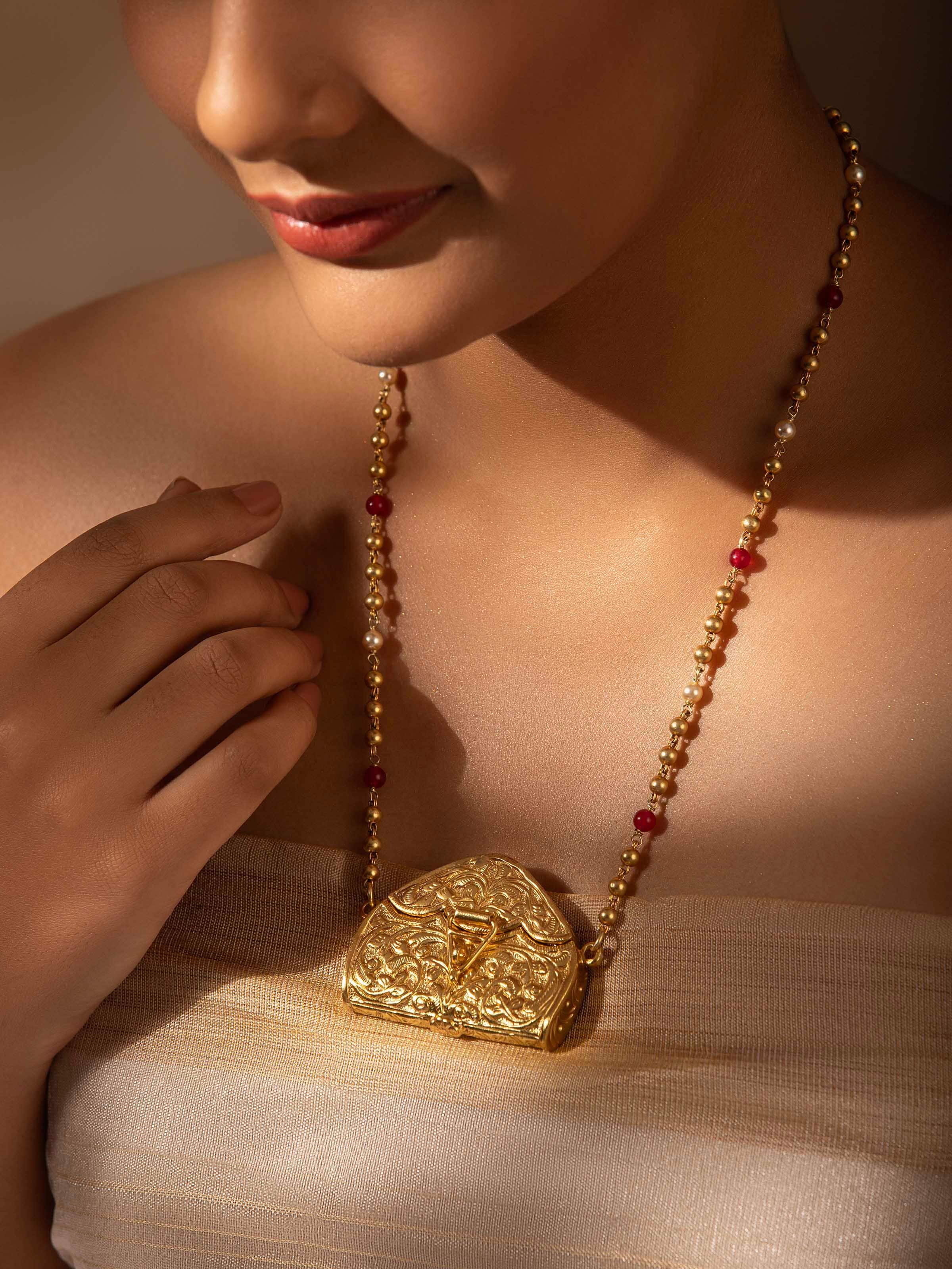 Close-up view of Chitai Silver Long Necklace highlighting detailed craftsmanship.