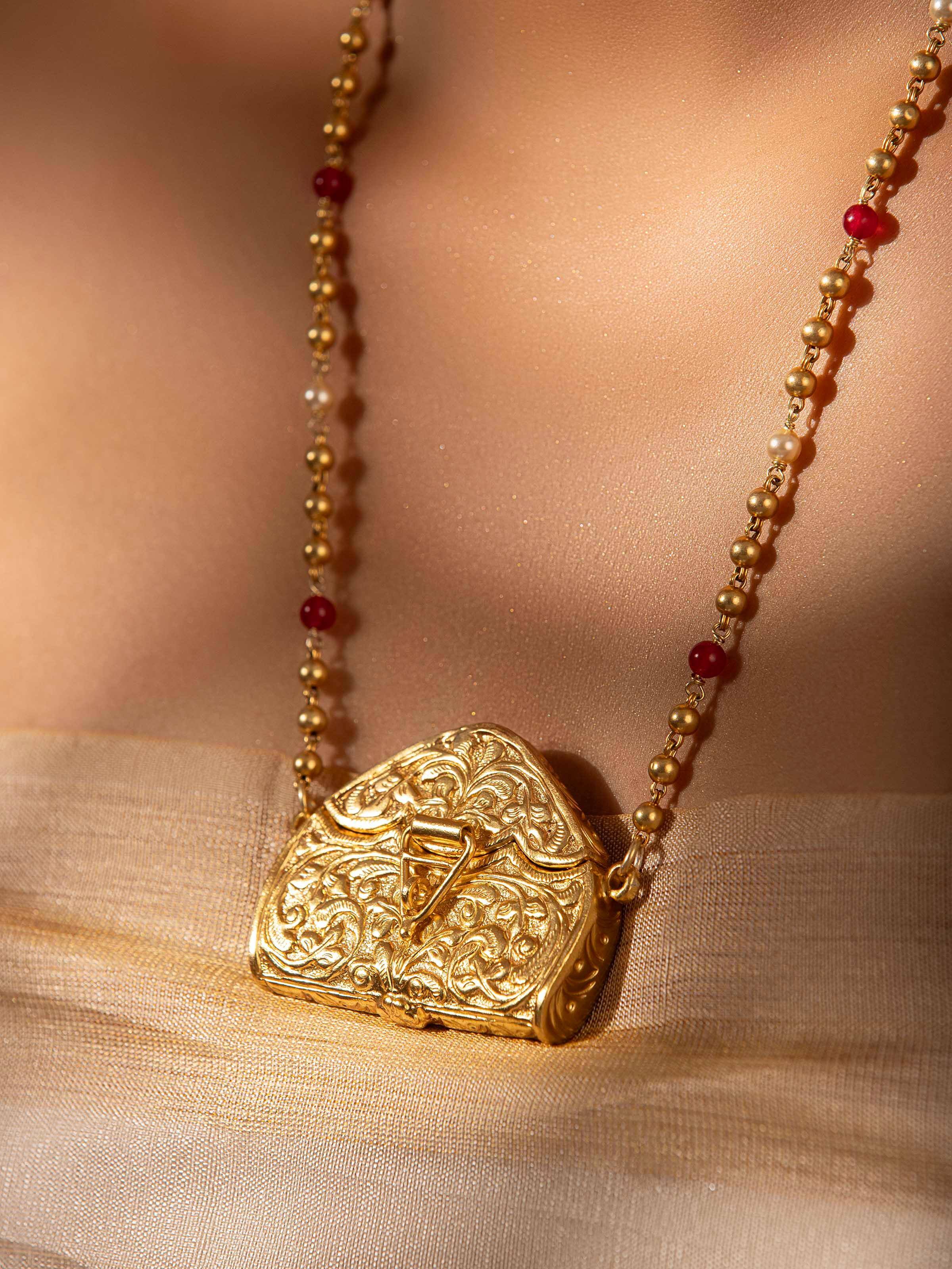 Side view of Chitai Silver Long Necklace displaying the elegant profile.