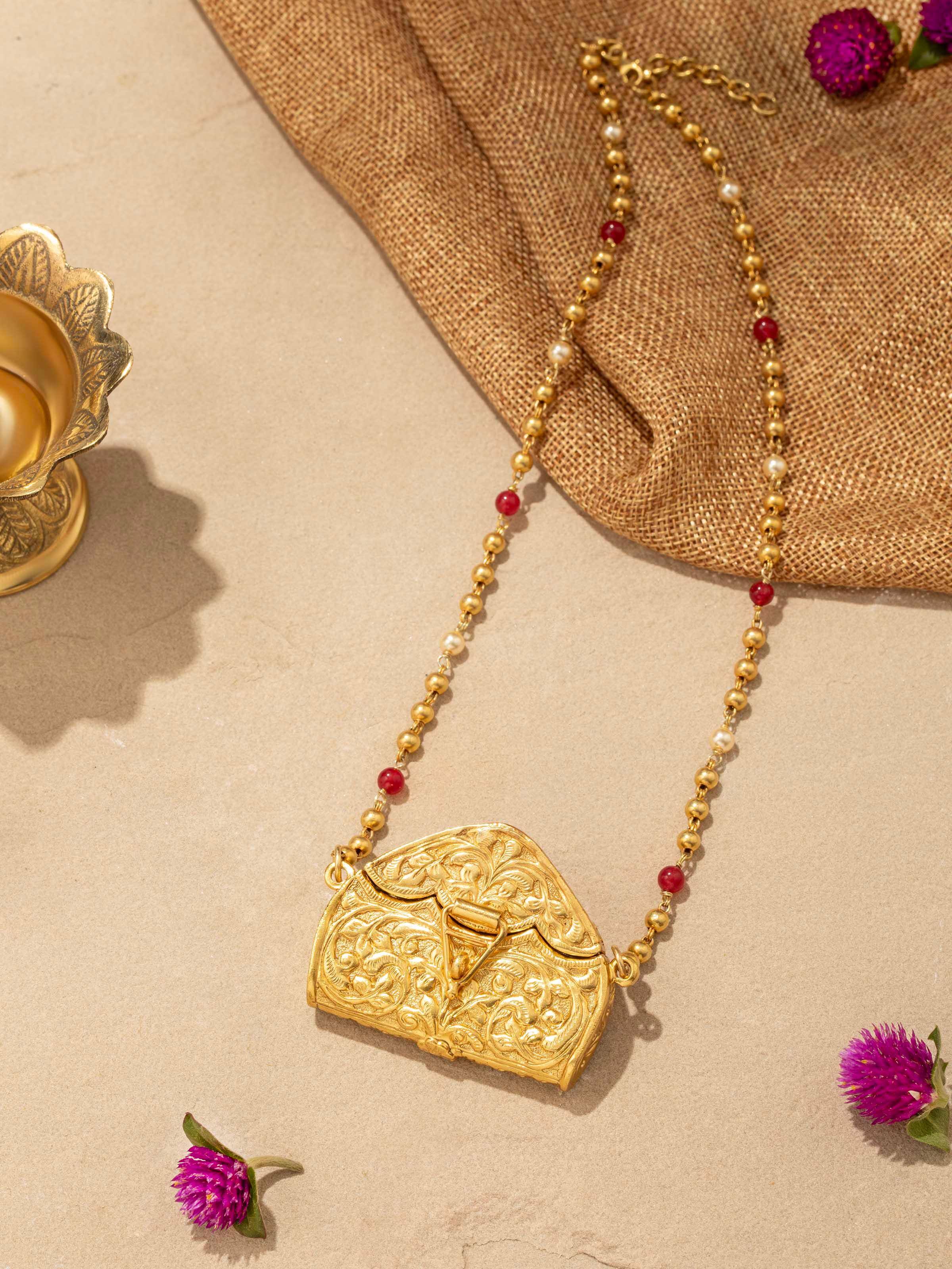 Angled view of Chitai Silver Long Necklace emphasizing the design details.