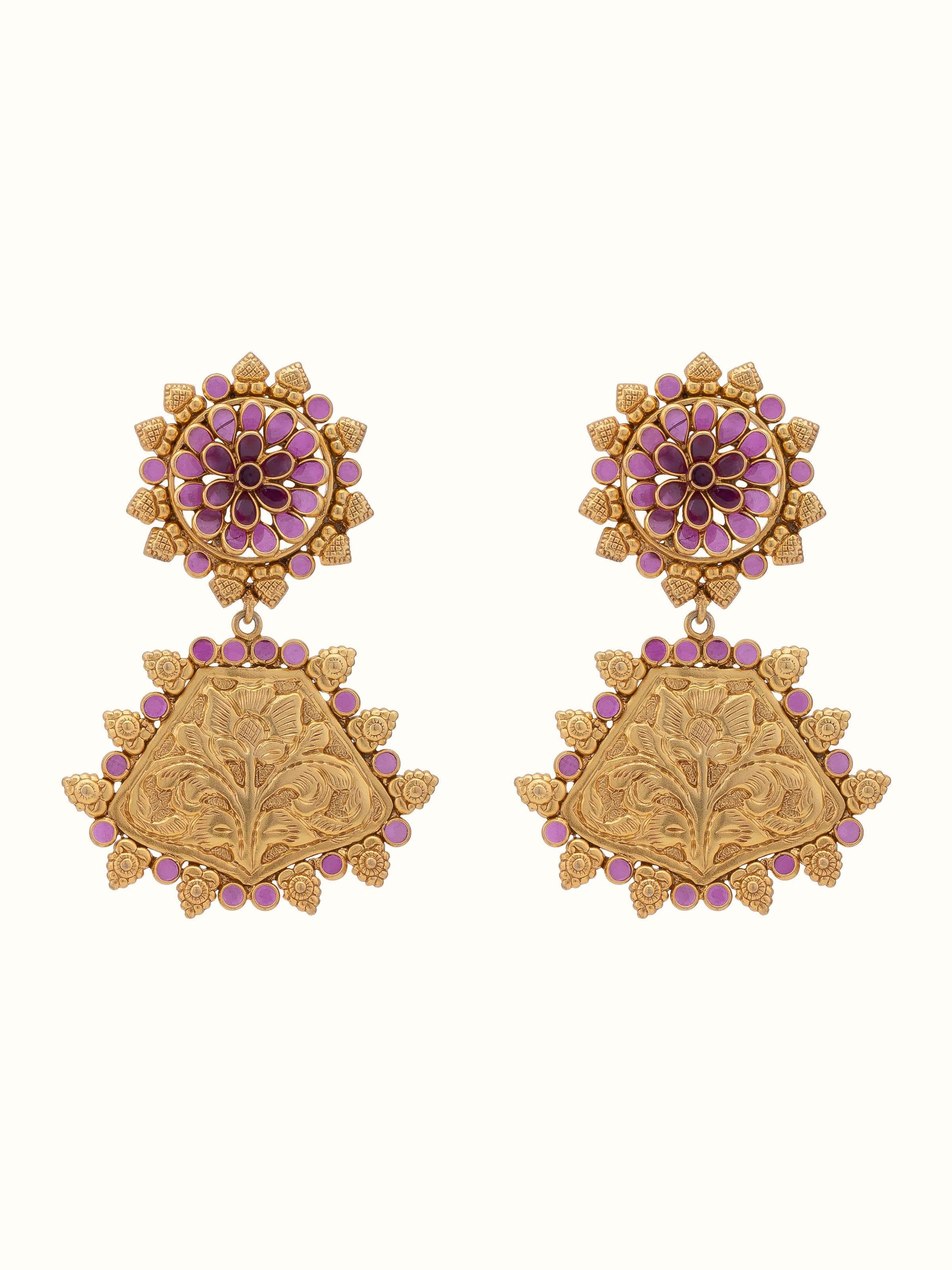 Front view of silver chitai drop earrings featuring intricate silverwork