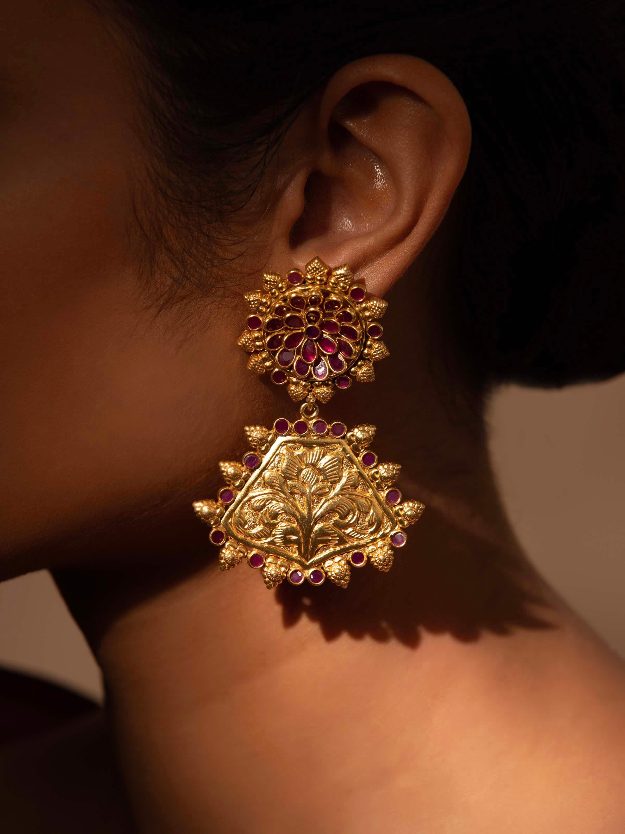 Side view of silver chitai drop earrings highlighting detailed design and craftsmanship