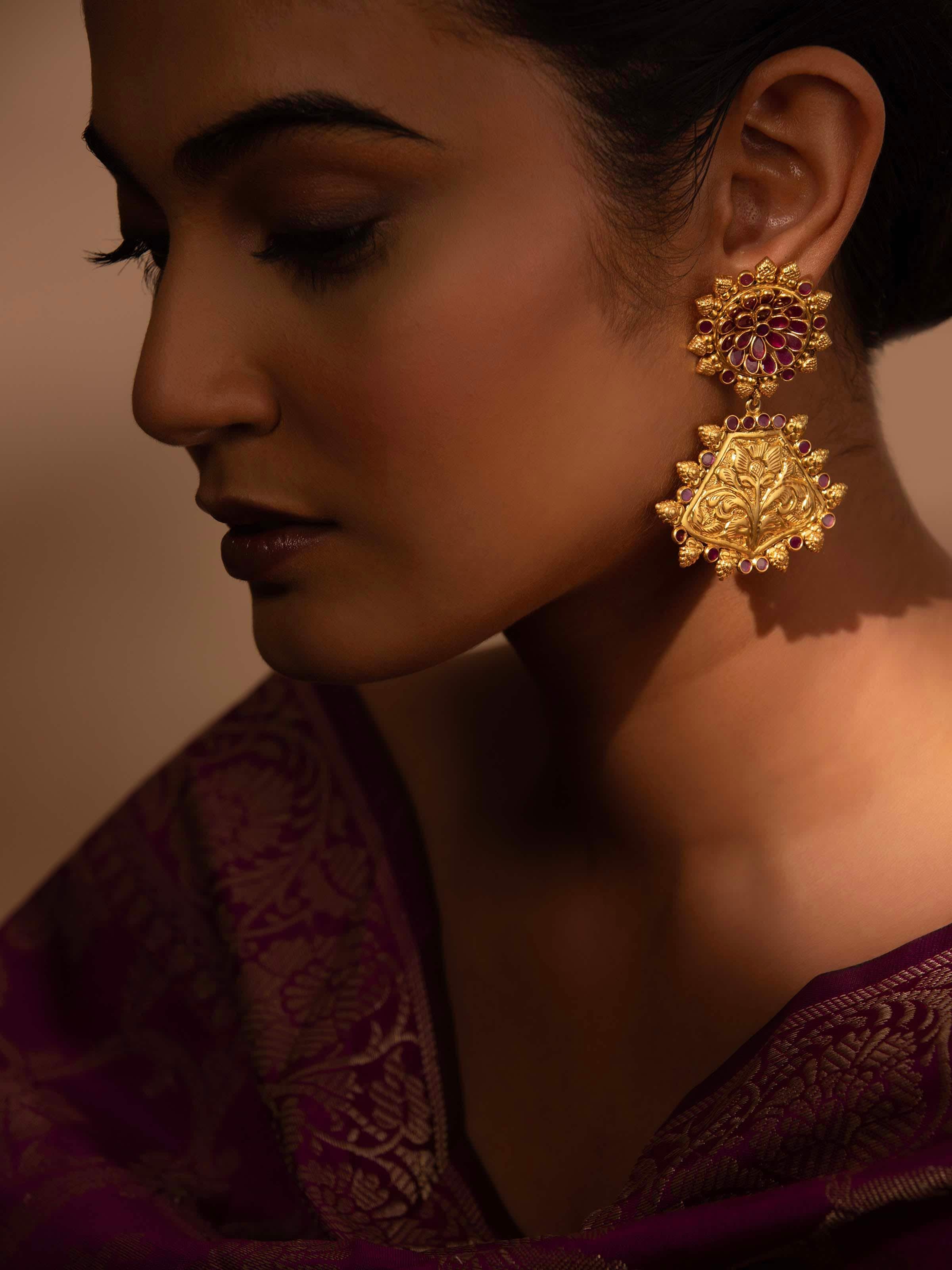 Close-up of silver chitai drop earrings emphasizing fine detailing and texture