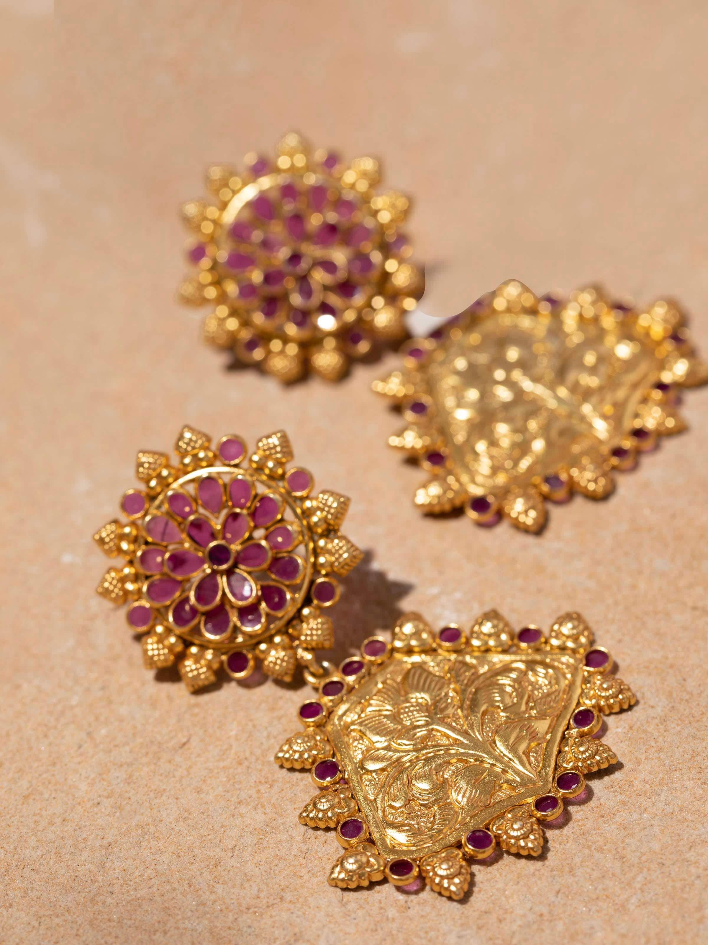 Detailed shot of silver chitai drop earrings with a focus on artisanal silverwork