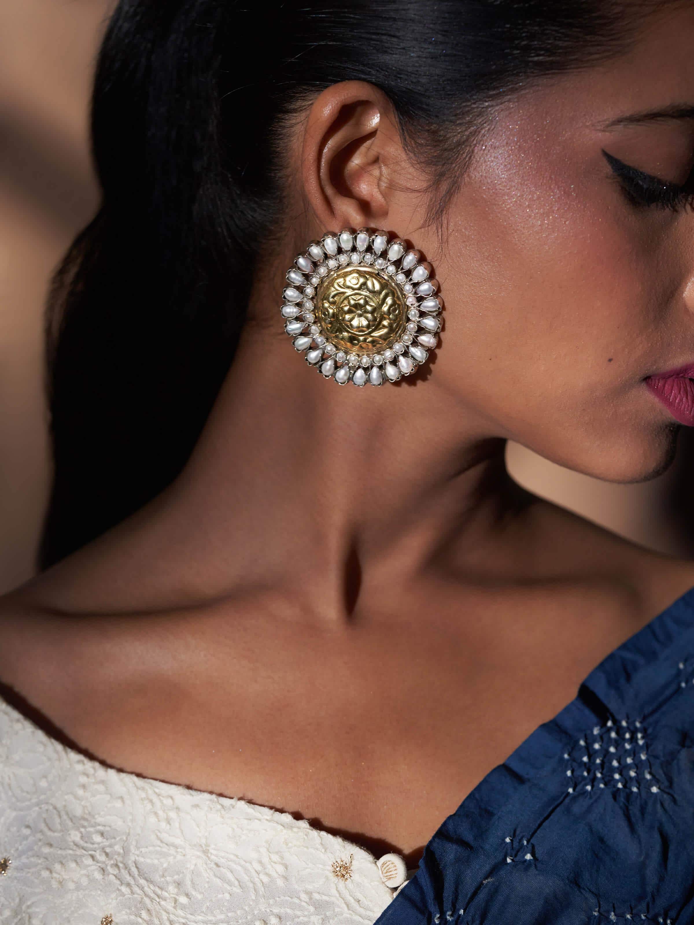 Close-up view of Chitai Silver Studs showcasing detailed craftsmanship and classic silver design.