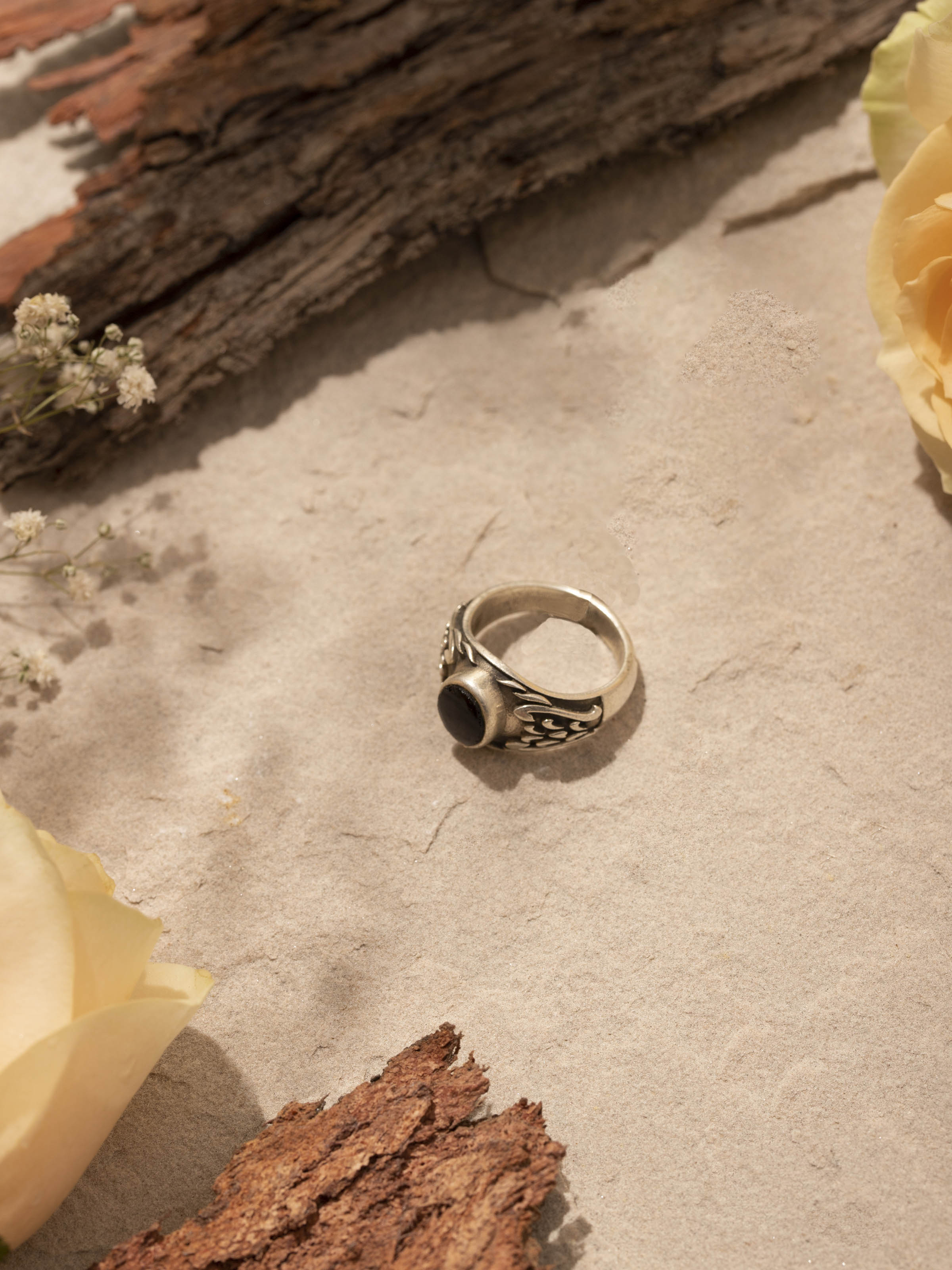 Side view of Chitai Silver Ring highlighting the detailed silverwork and band design.