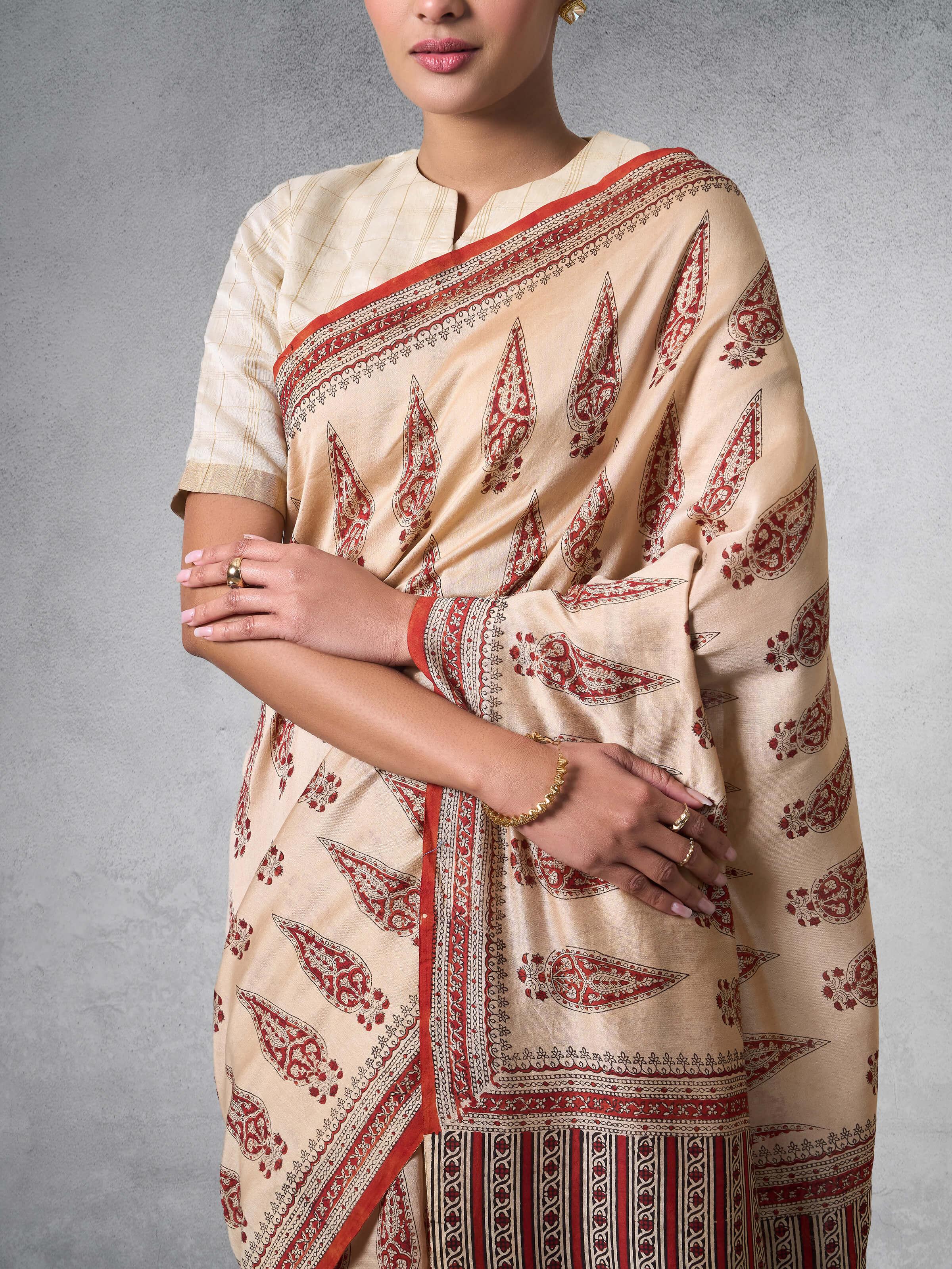Detailed shot focusing on the texture and craftsmanship of Bagru block printing on the saree