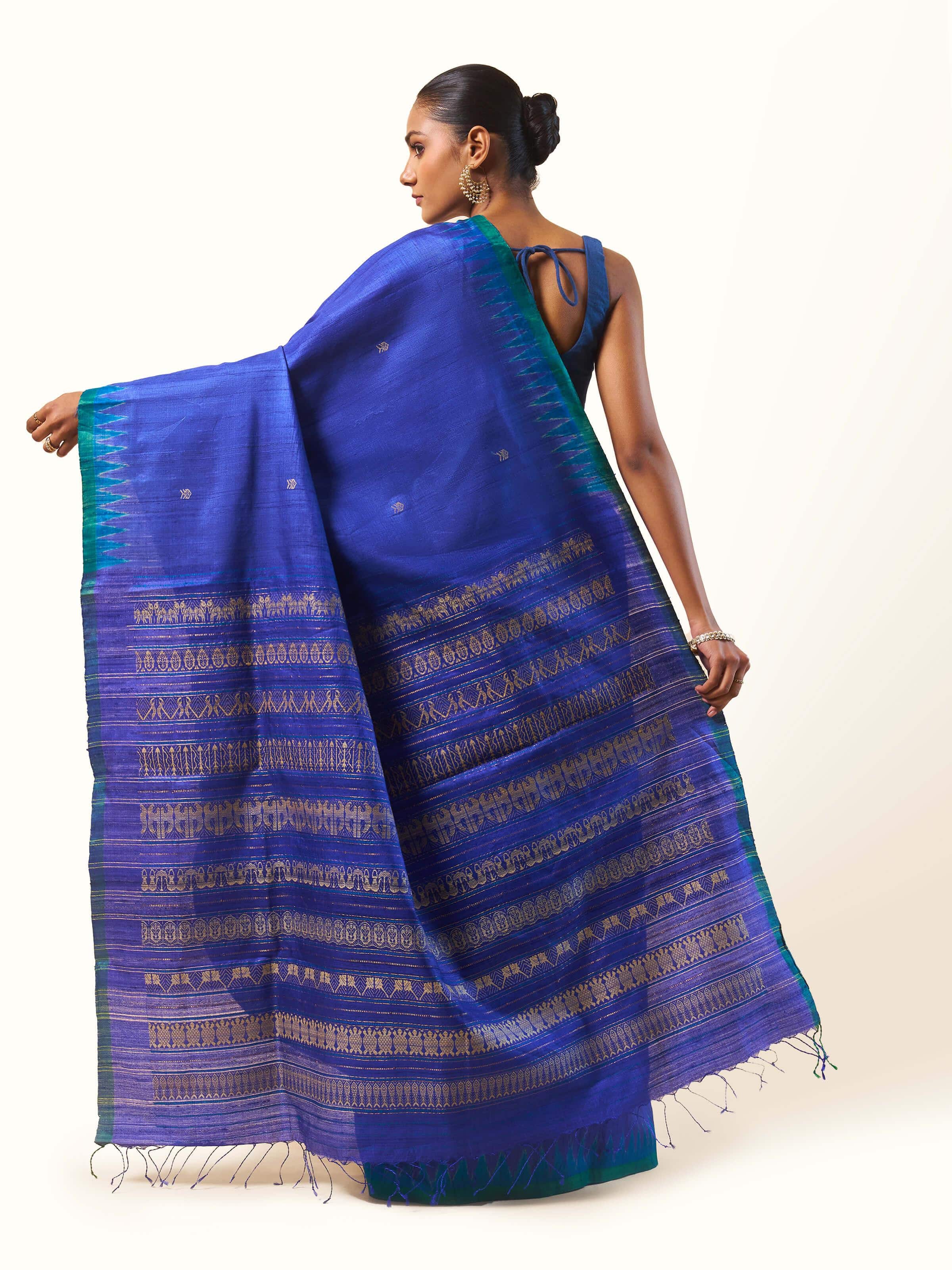 Top view of Tussar Silk Saree featuring traditional motifs and smooth fabric texture