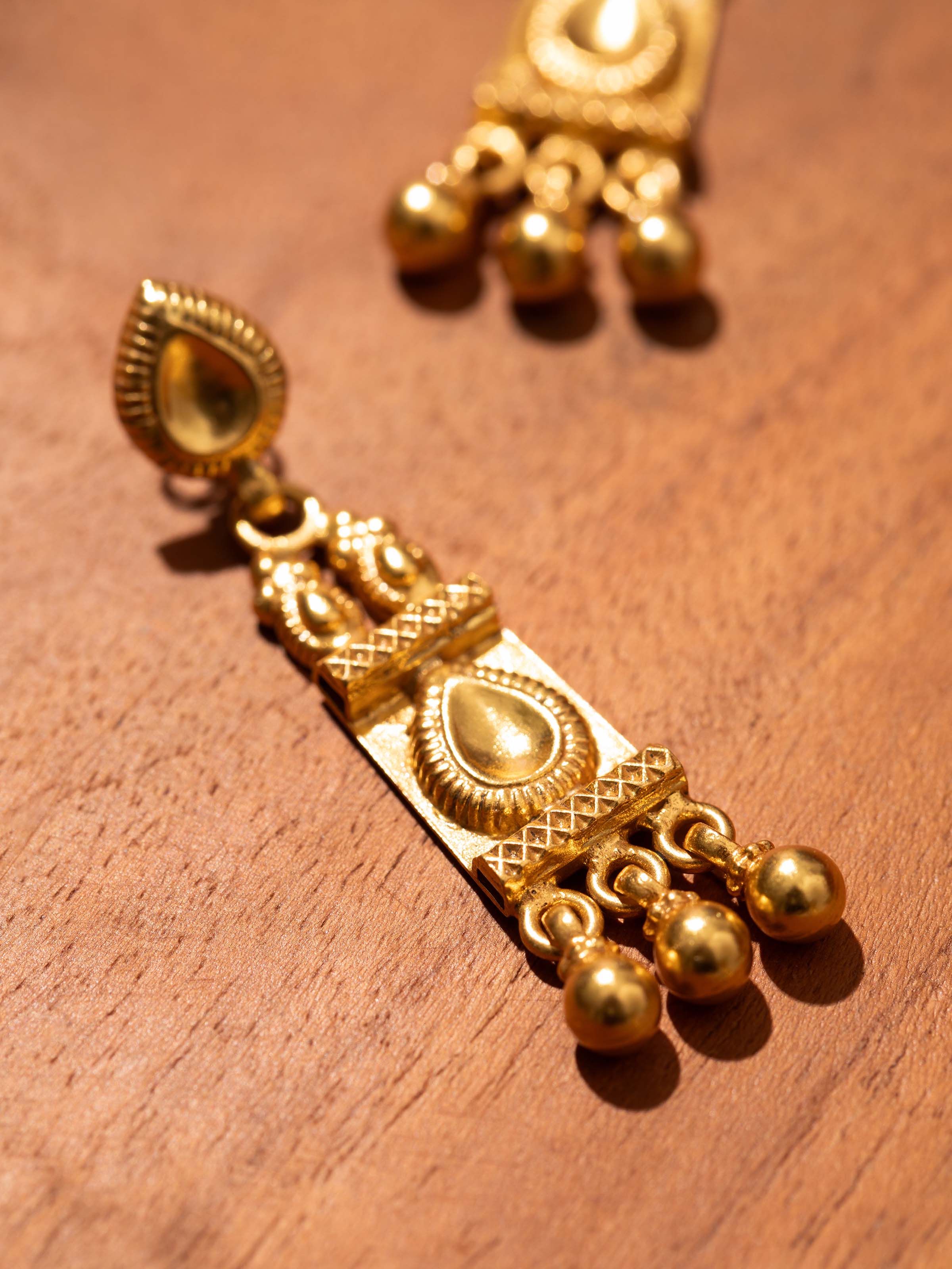 Angled view of Patwa Collar Necklace highlighting intricate embroidery work.