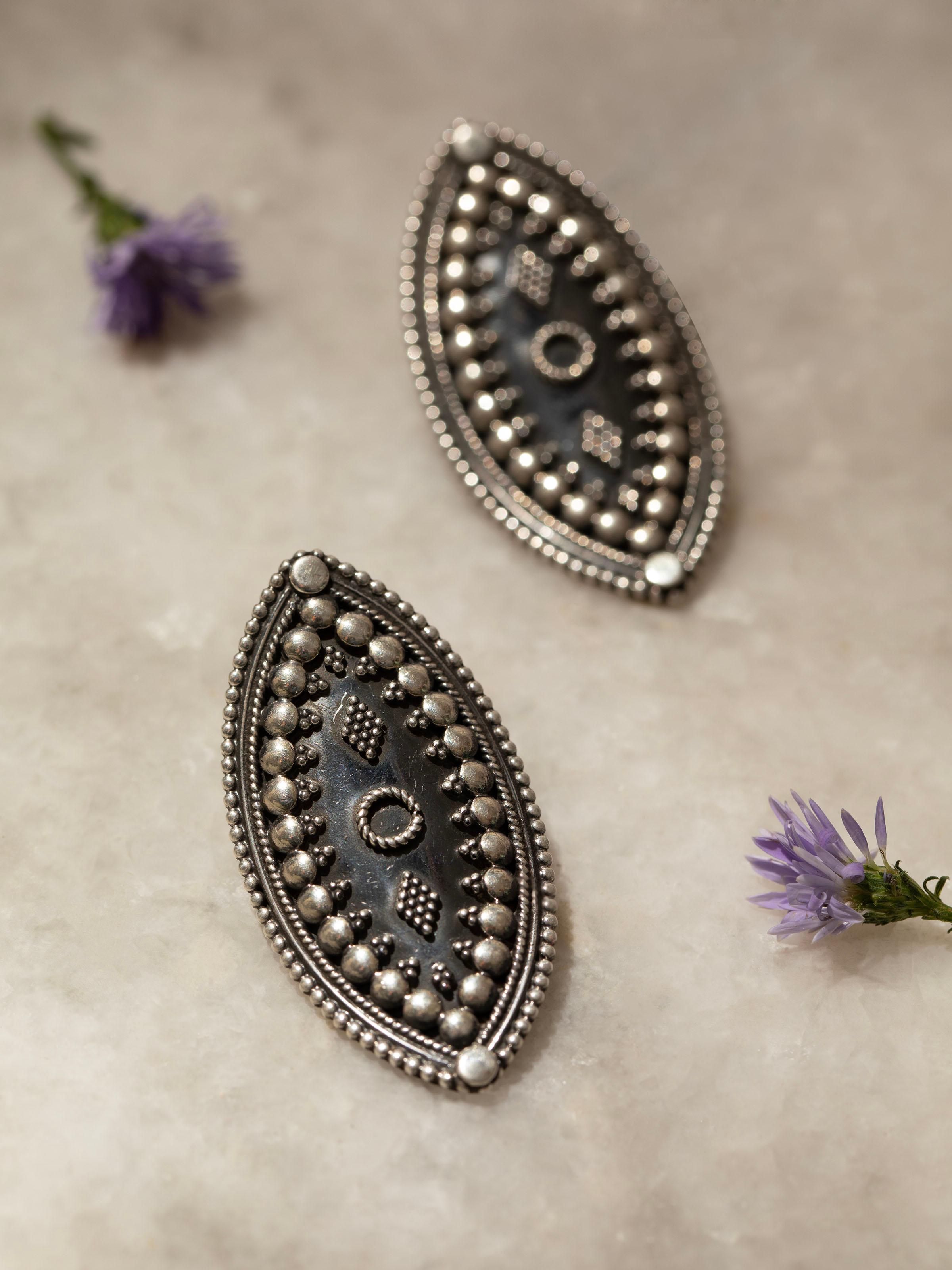 Back view of Silver Smithing Stud Earrings highlighting the earring's post and design.