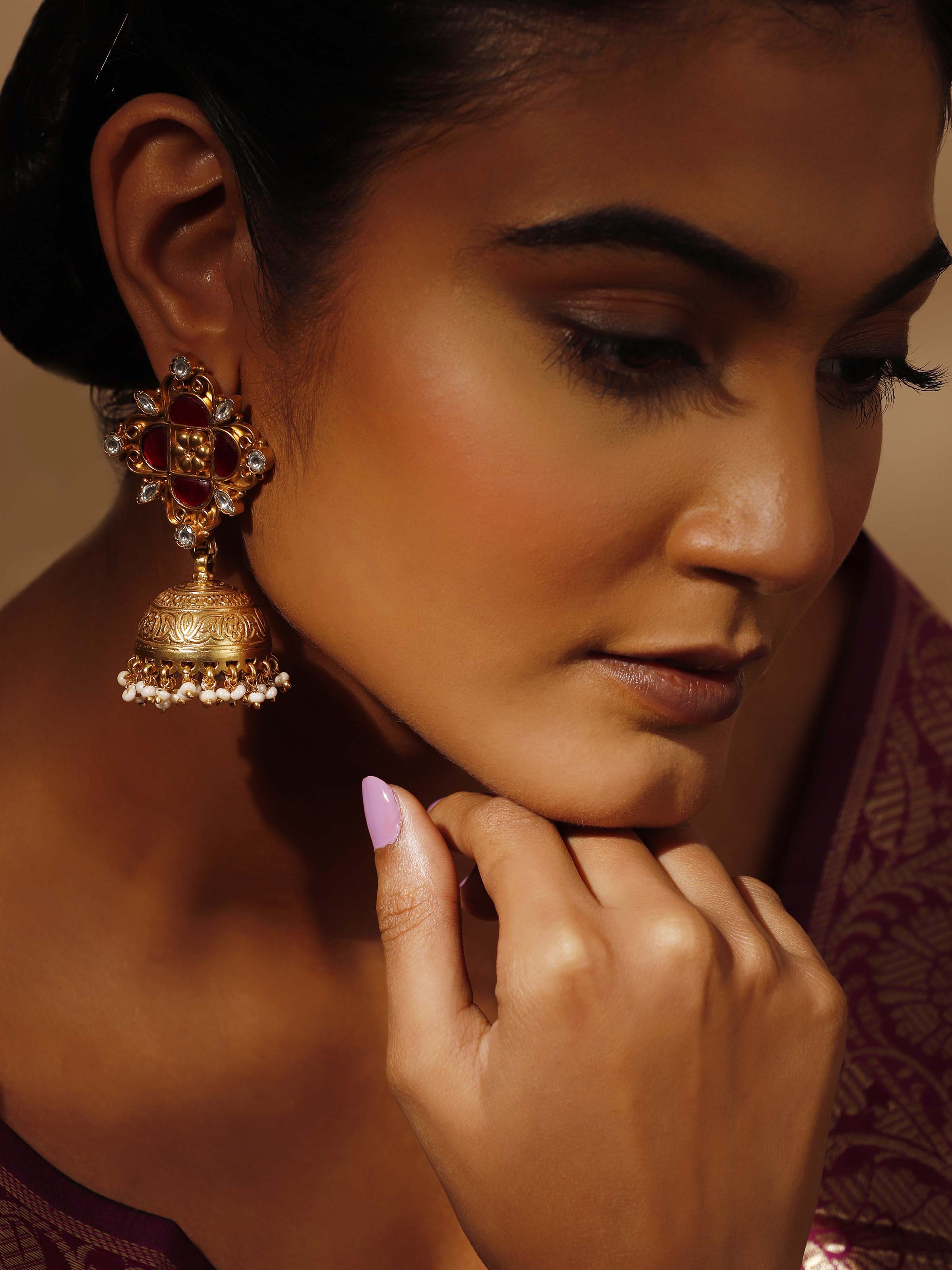 Side view of Silver Smithing Jhumkas showcasing their intricate design and elegant craftsmanship.