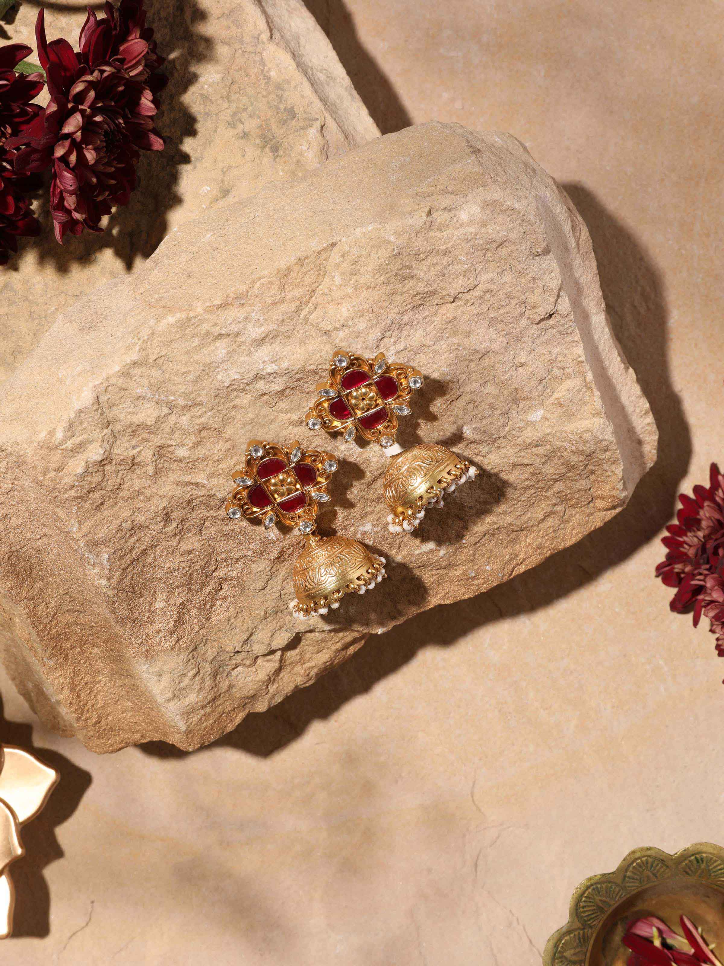 Angled view of Silver Smithing Jhumkas emphasizing their ornate design and detailed craftsmanship.