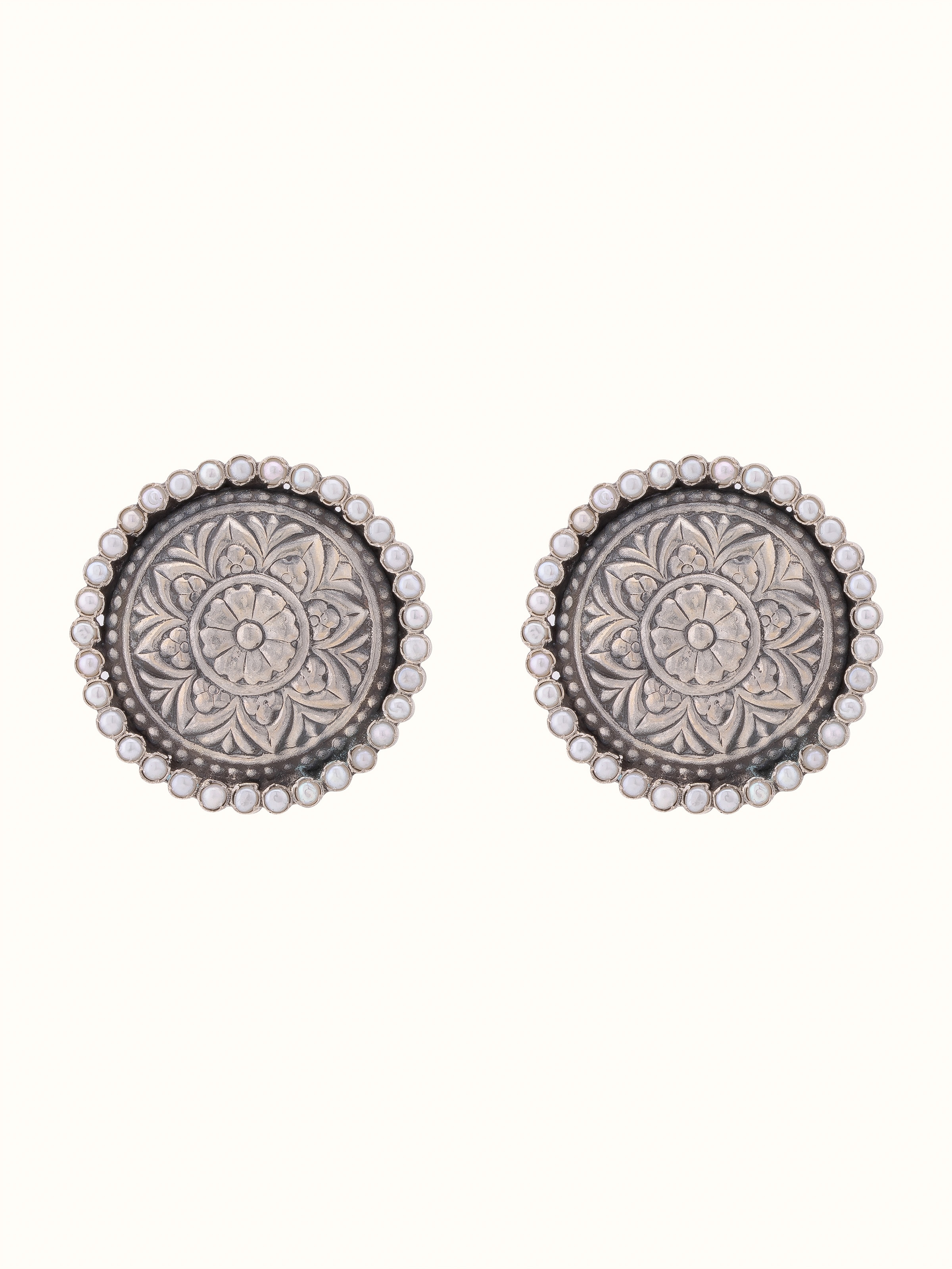 Front view of Silver Smithing stud earrings highlighting detailed silverwork and elegant design