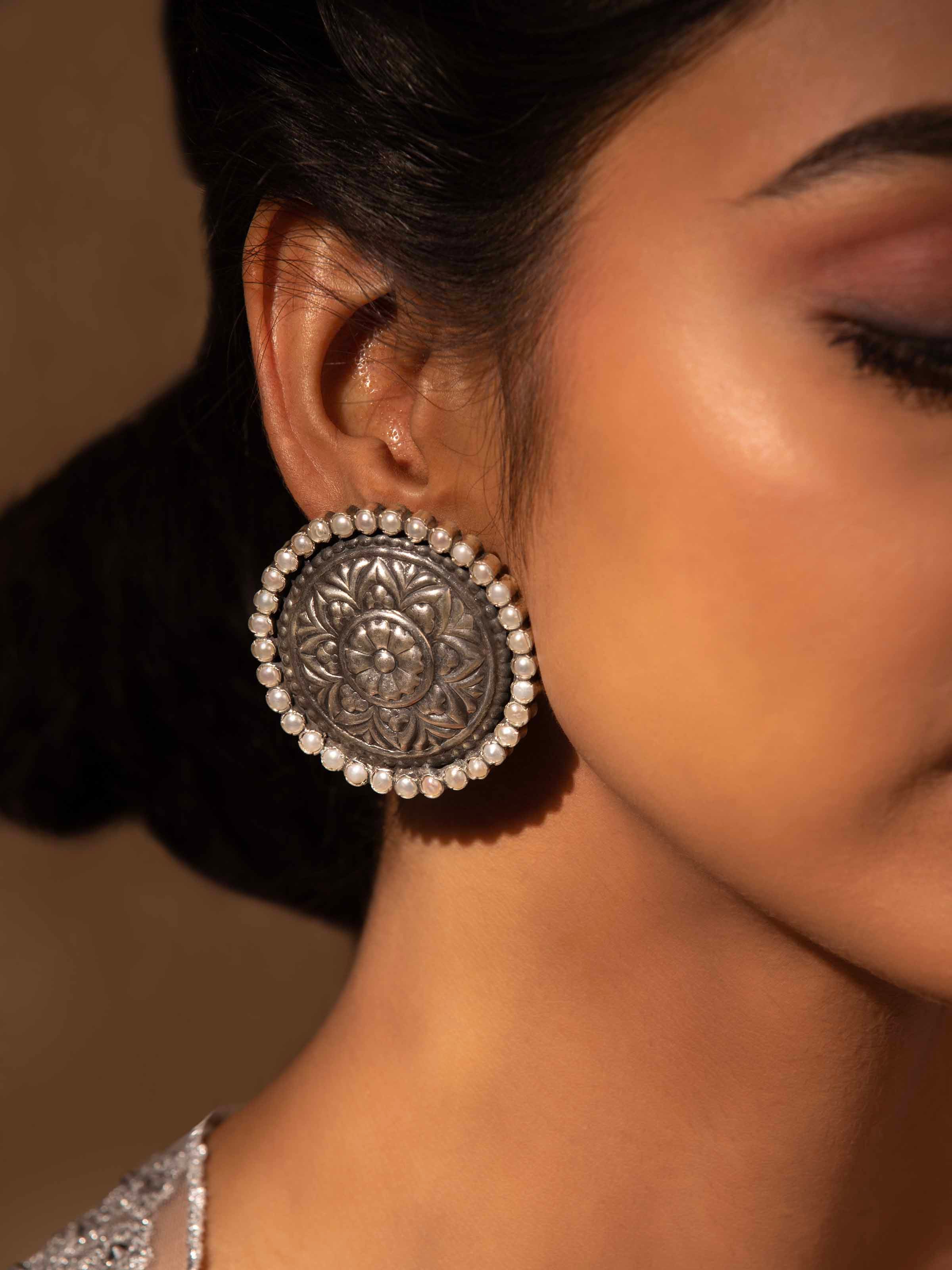 Side view of Silver Smithing stud earrings showcasing refined craftsmanship and stylish finish