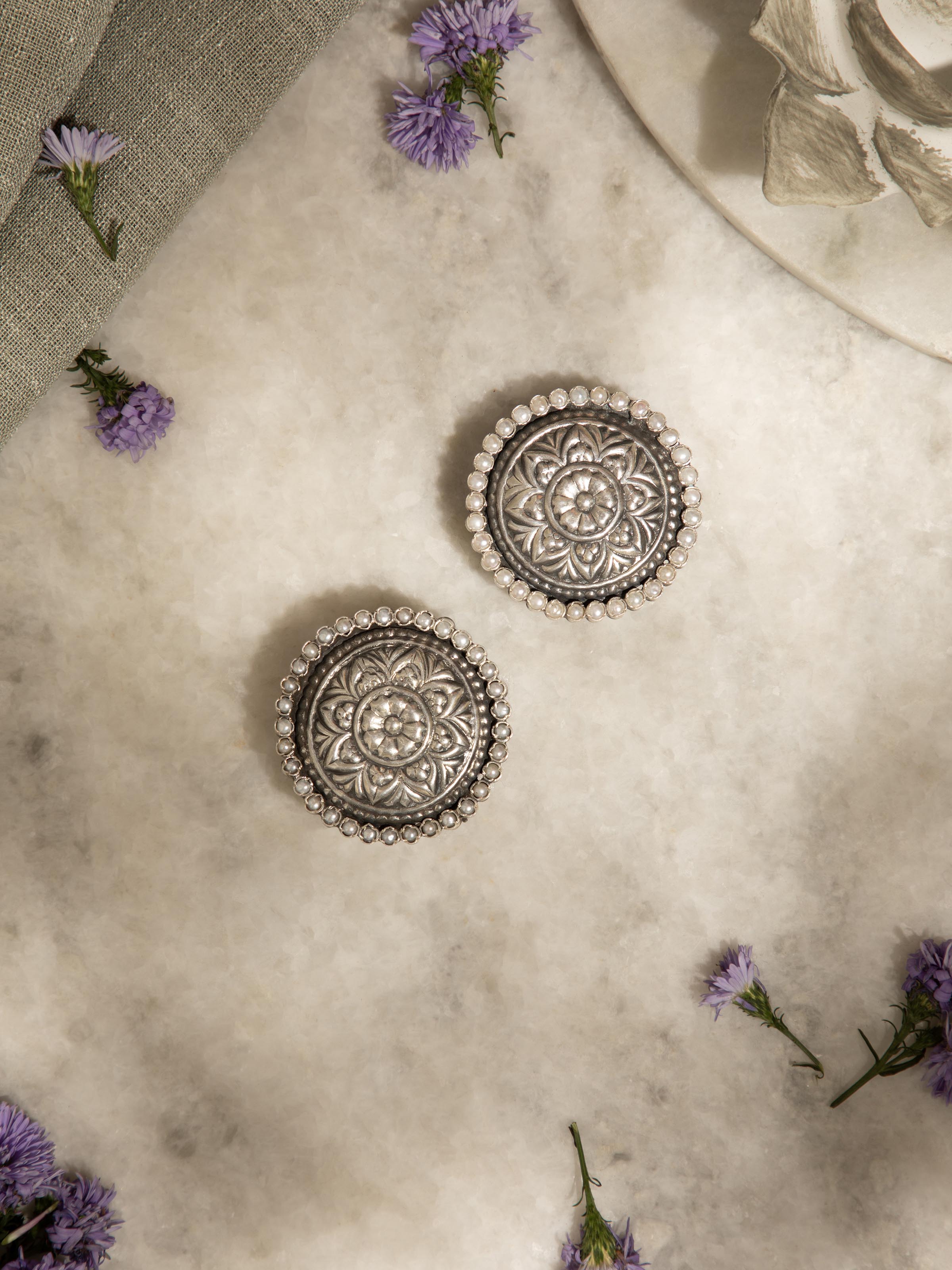 Angled view of Silver Smithing stud earrings highlighting its elegant design and craftsmanship