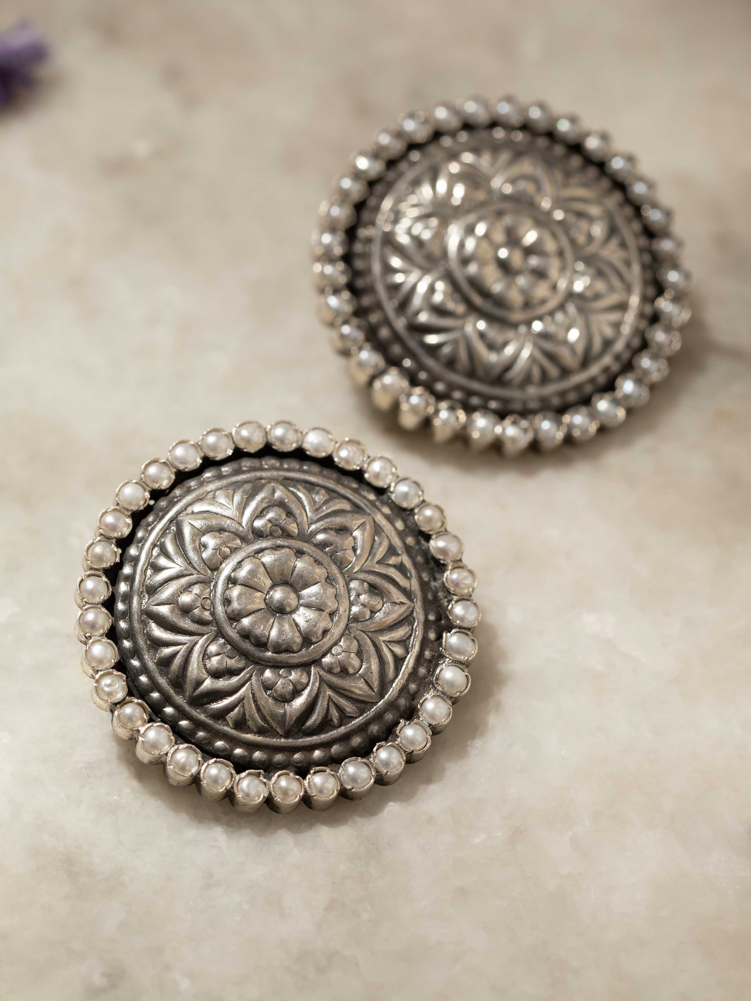 Detailed view of Silver Smithing stud earrings showcasing fine craftsmanship and stylish design