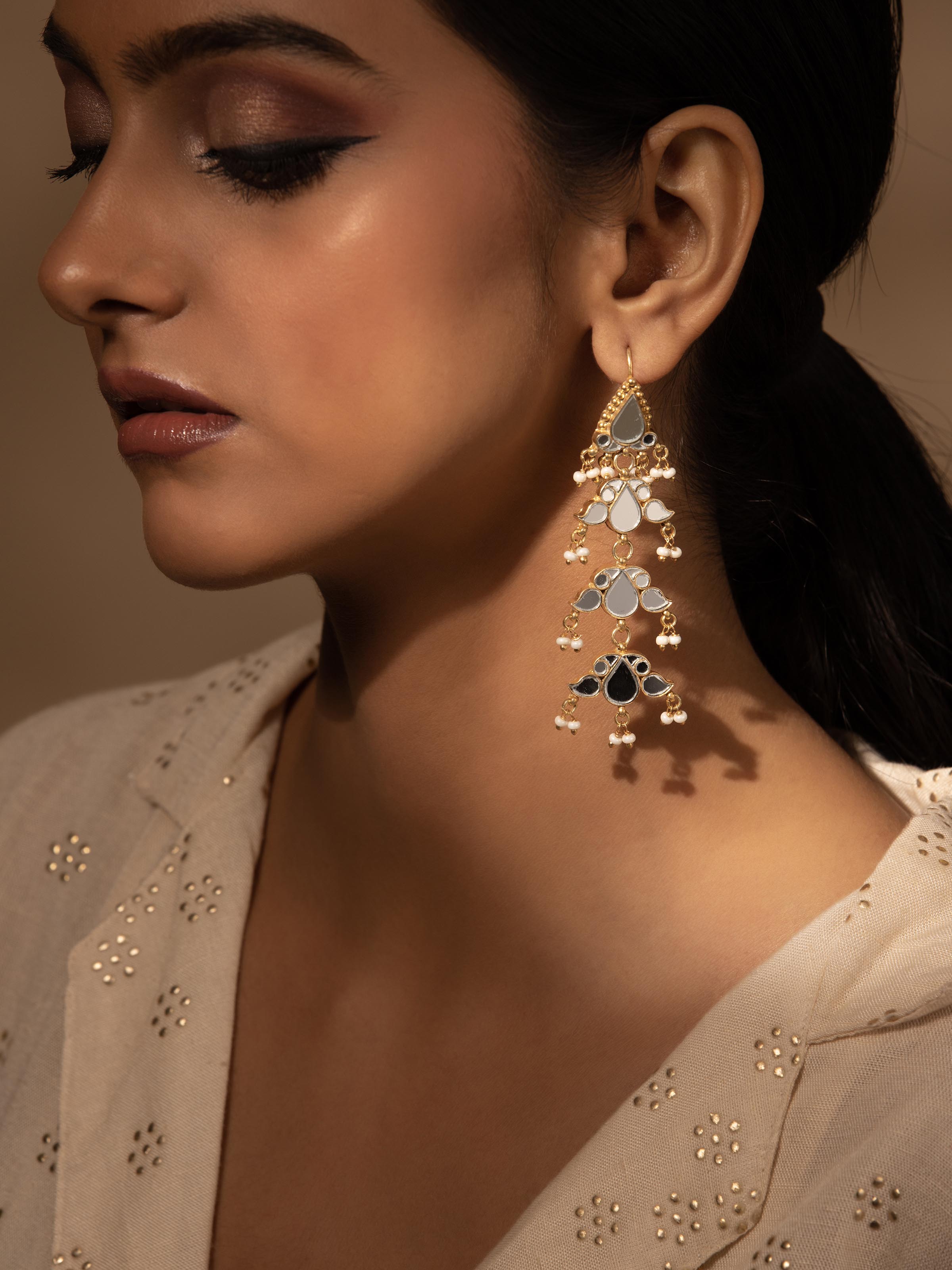 Close-up view of Silver Smithing Drop Earrings featuring fine silverwork and intricate design details.