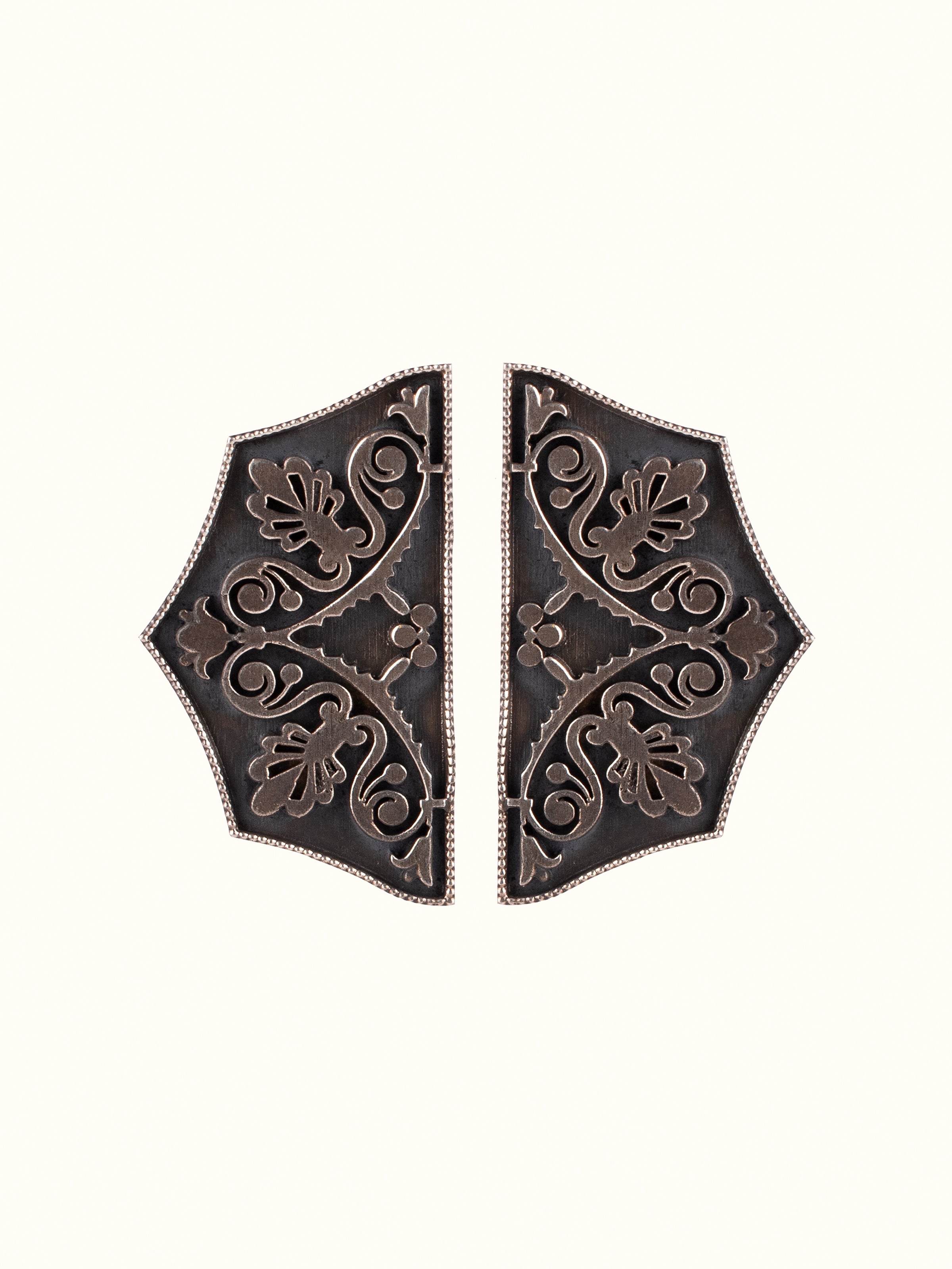 Front view of Silver Smithing Stud Earrings showcasing sleek design and polished silver finish.