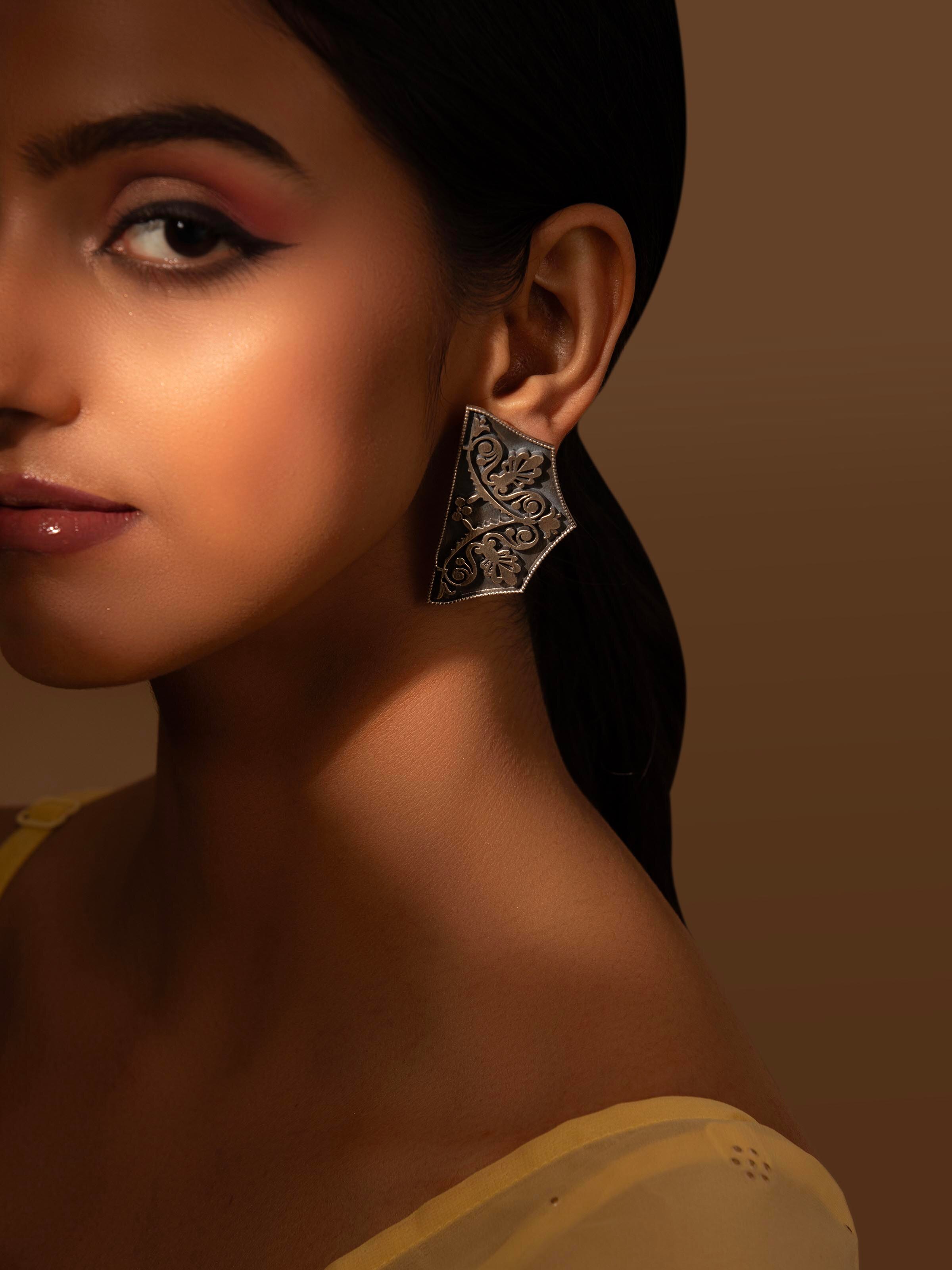 Side view of Silver Smithing Stud Earrings emphasizing the elegant design and high-quality finish.