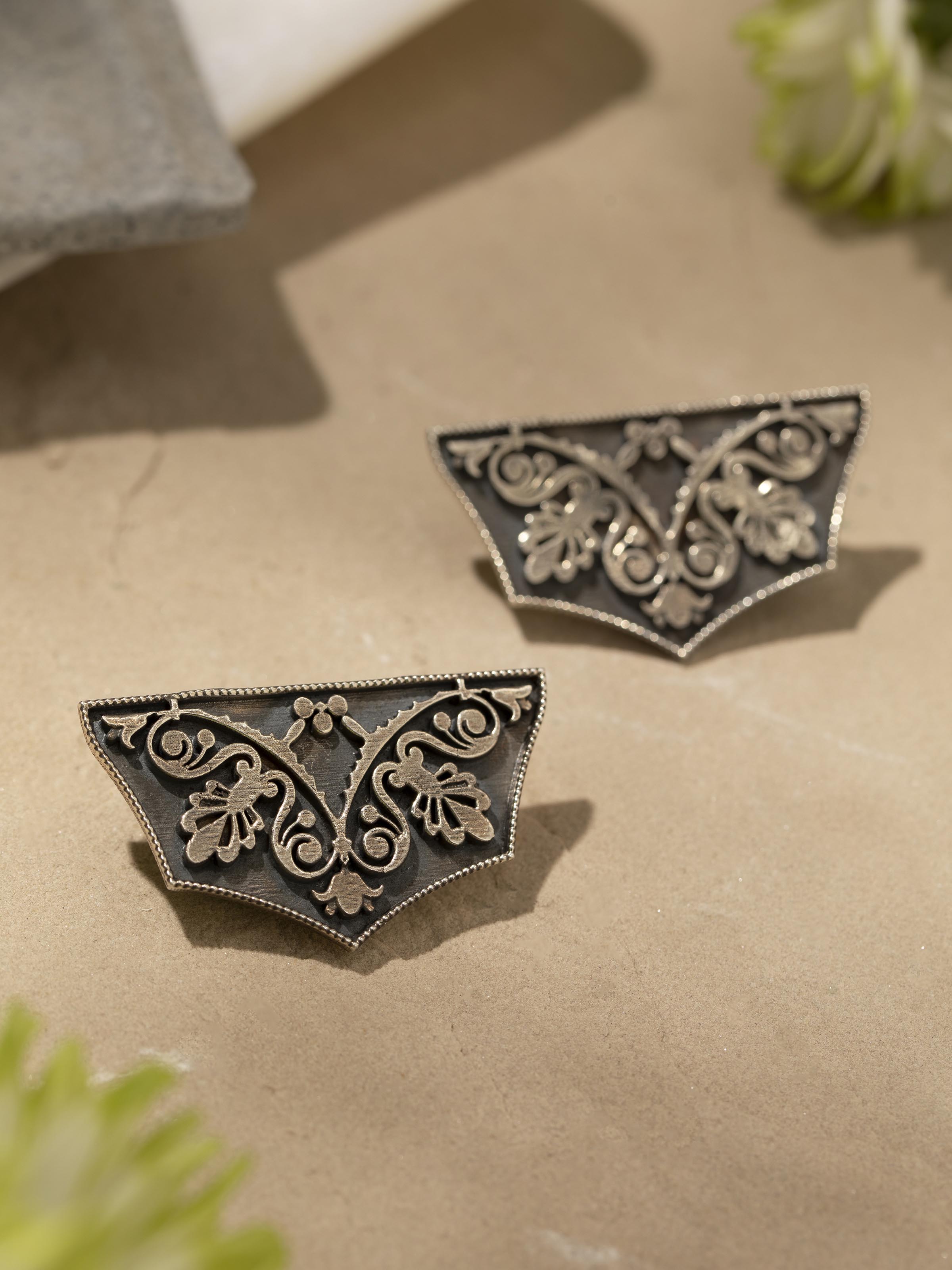Detailed view of Silver Smithing Stud Earrings focusing on the intricate design and polished finish.