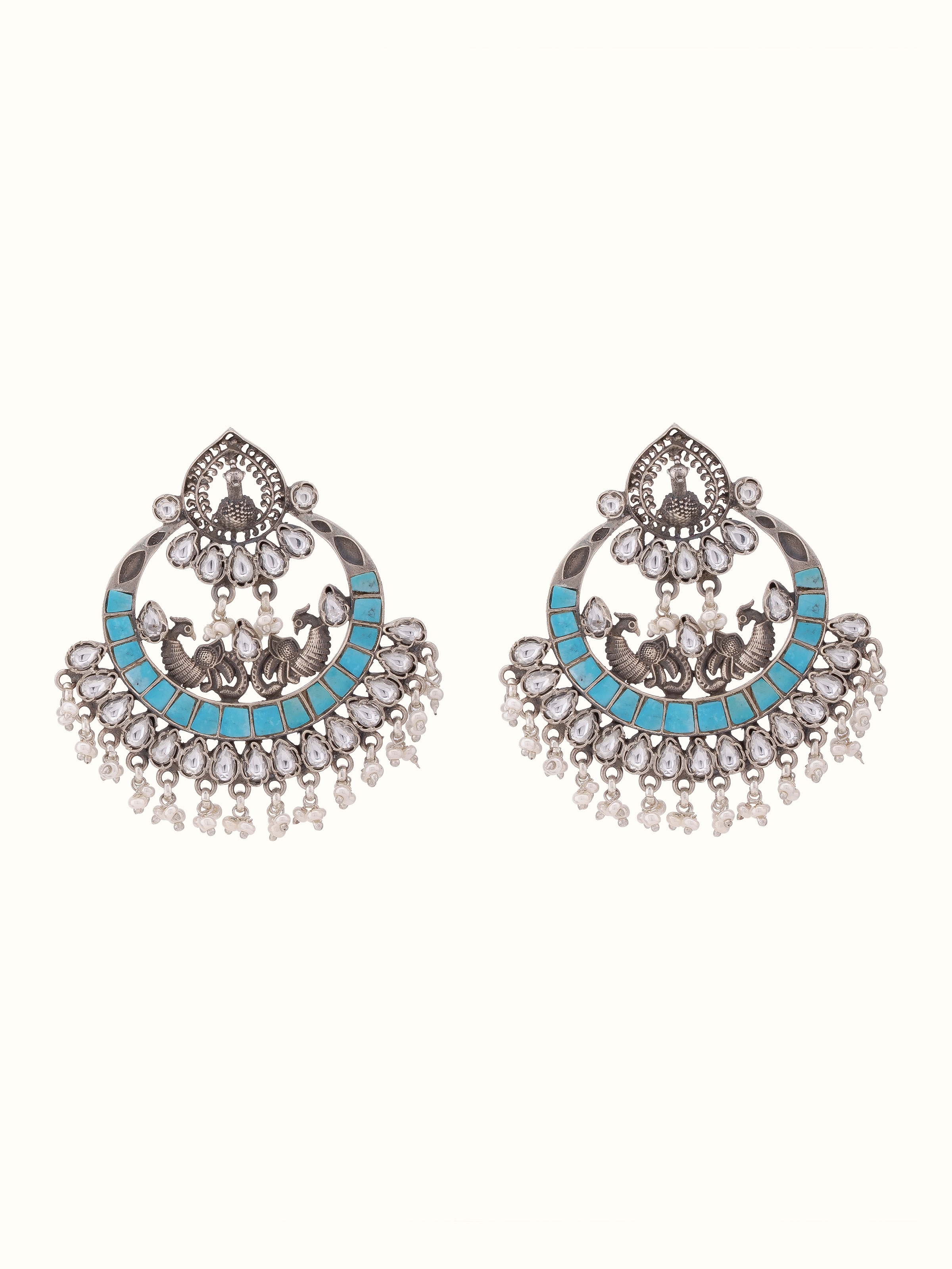 Overhead view of Silver Smithing Chaandbaali Earrings showcasing intricate silver design and detailing.