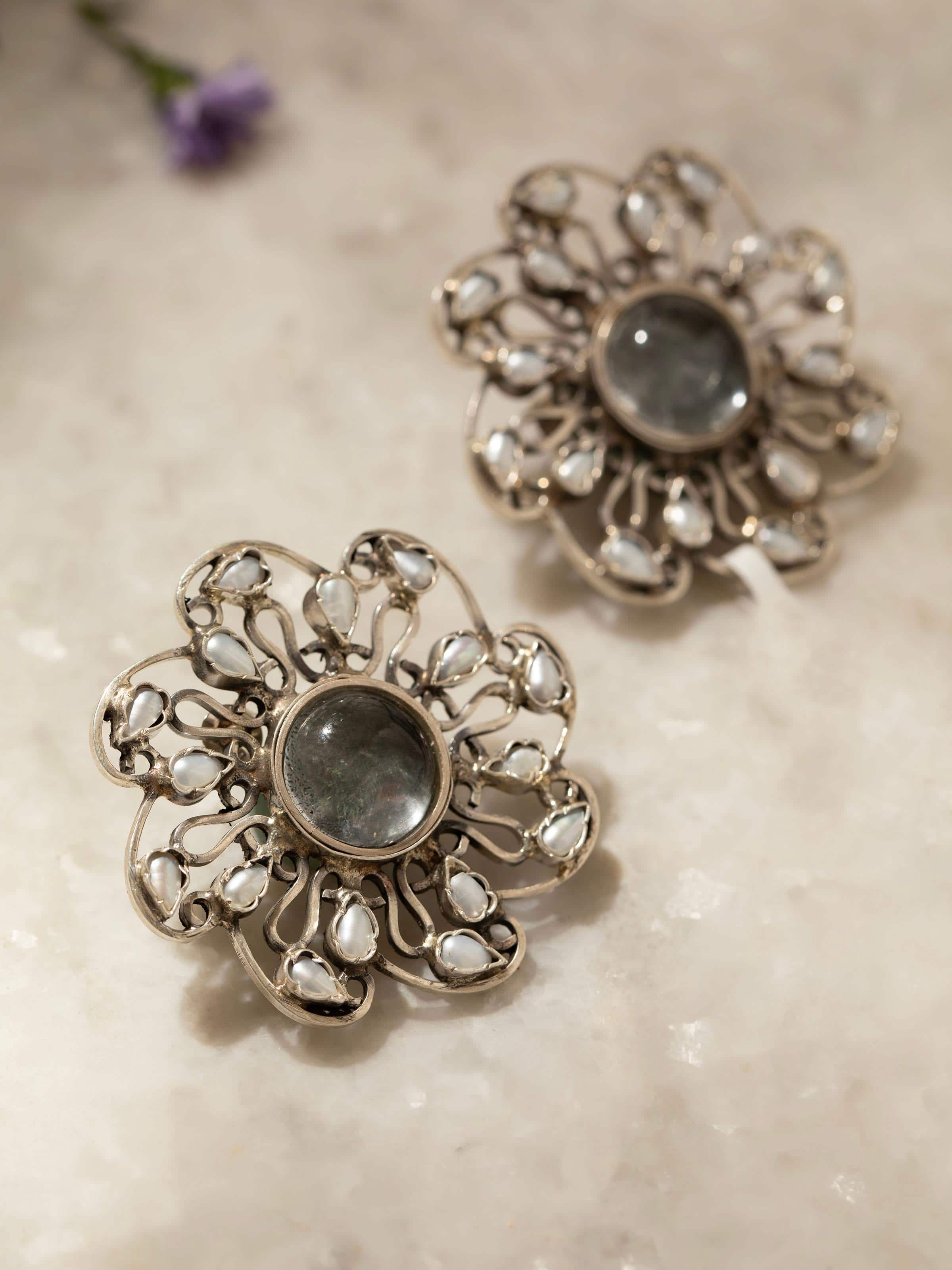 Profile shot showing silver stud earrings from a different angle