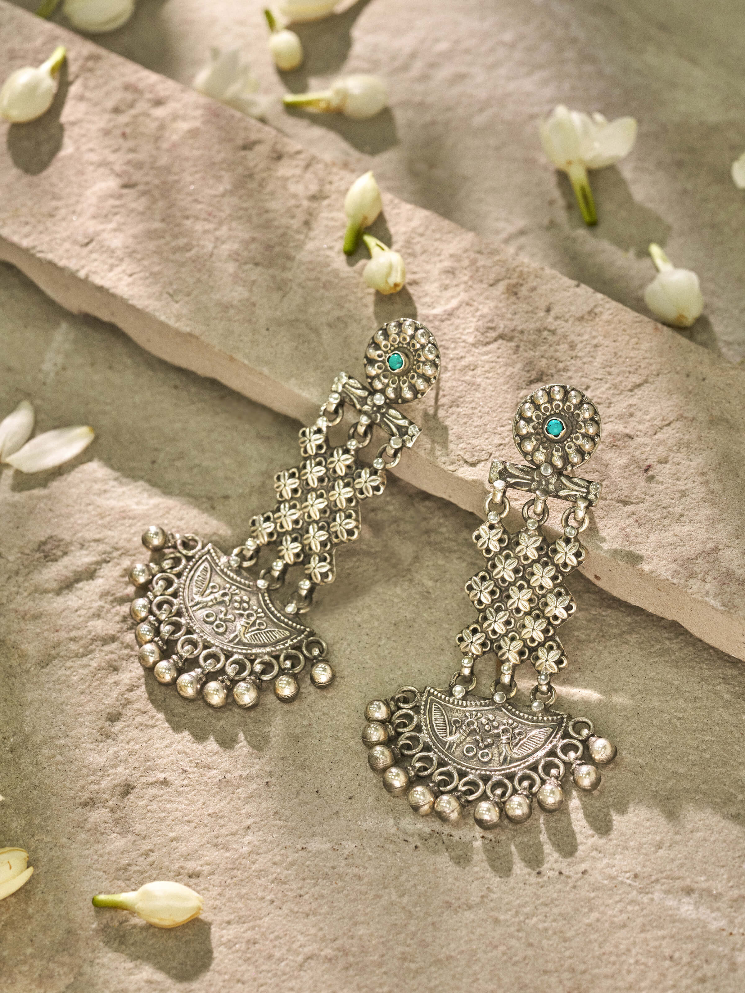 Close-up view of Silver Smithing Chandelier Earrings revealing the intricate silver detailing and chandelier elements.