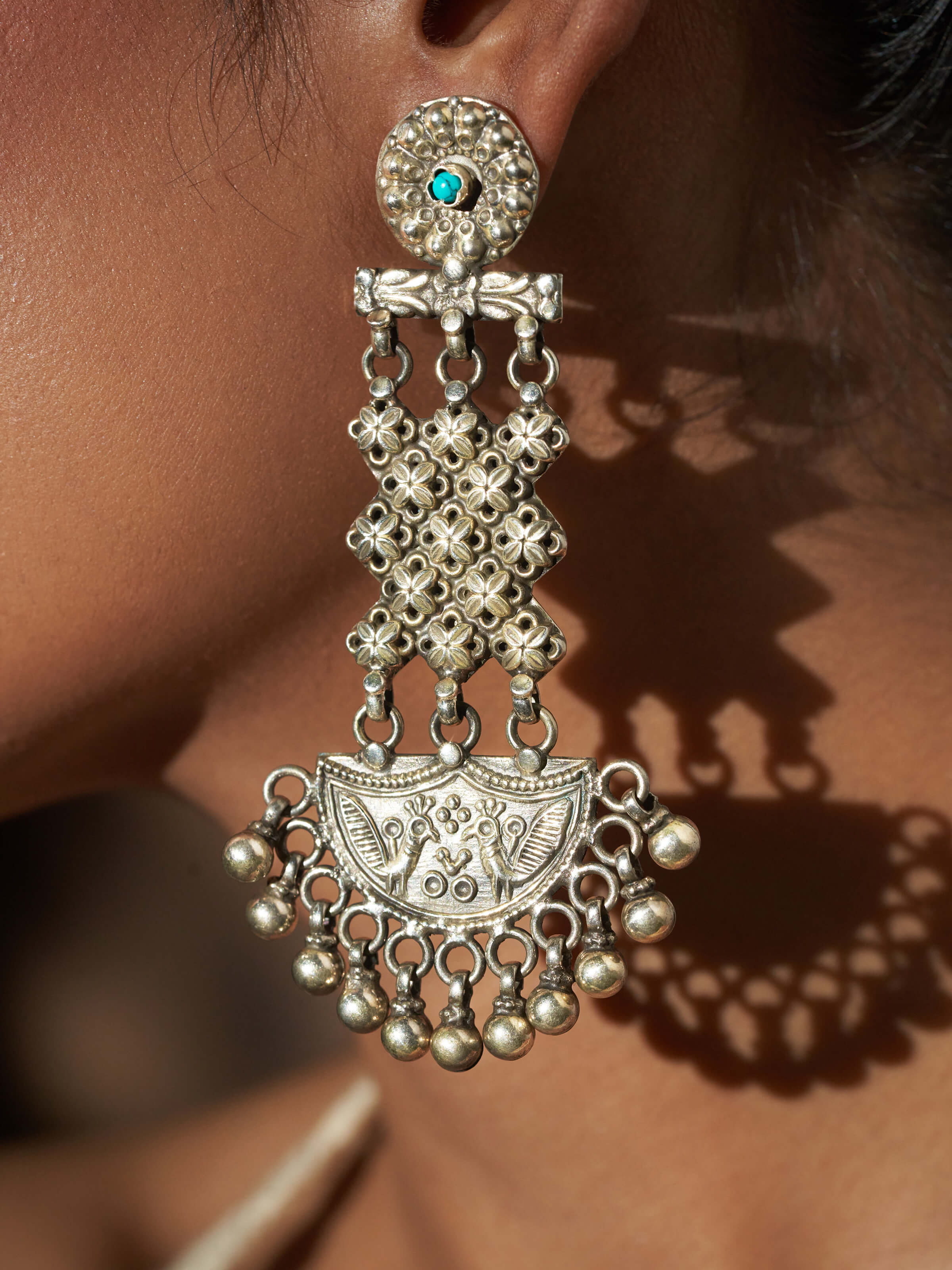 Detailed close-up of Silver Smithing Chandelier Earrings showcasing the refined silverwork and chandelier design.