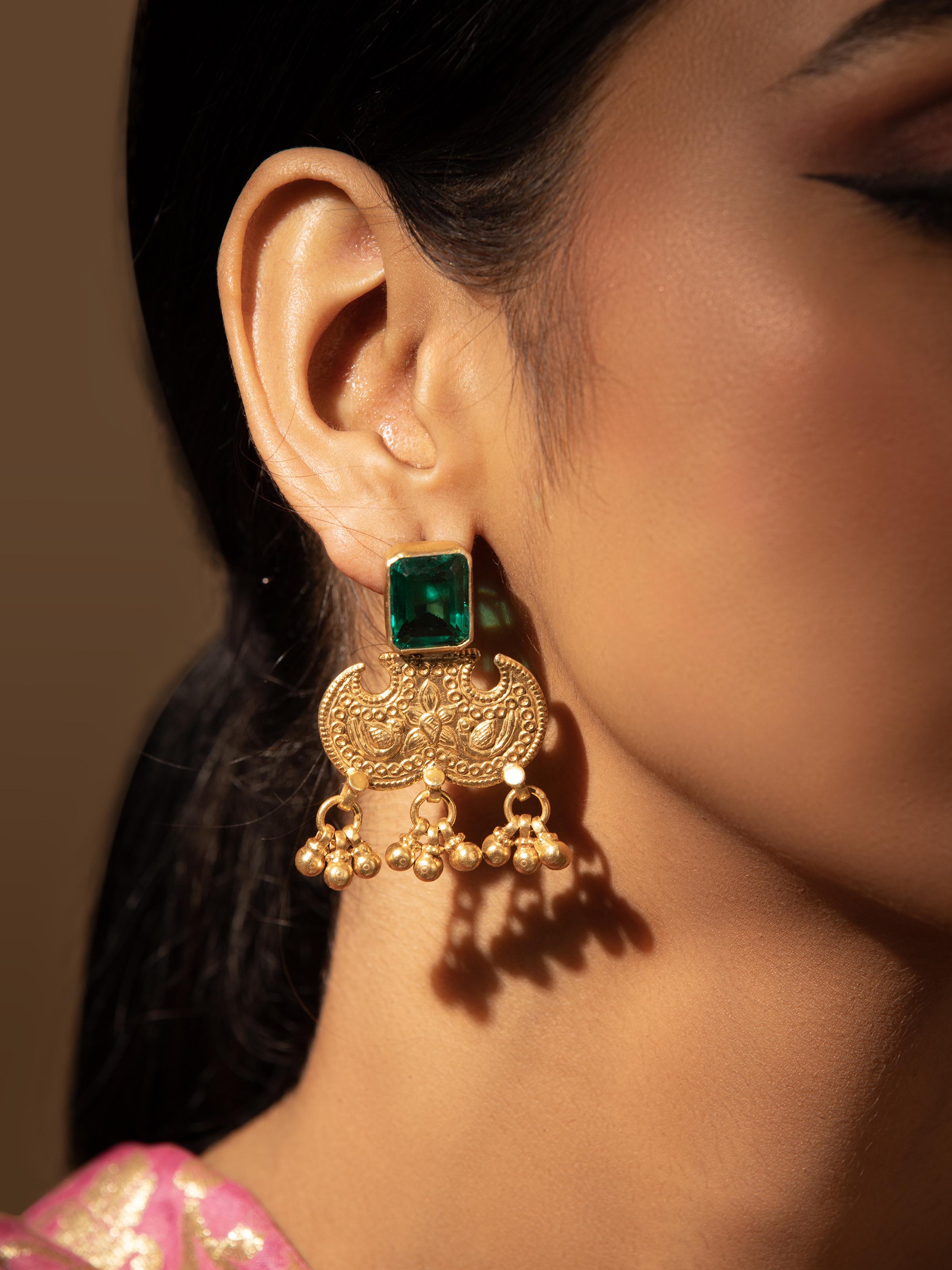 Side view of Silver Smithing Drop Earrings highlighting the detailed metalwork and dangle design.