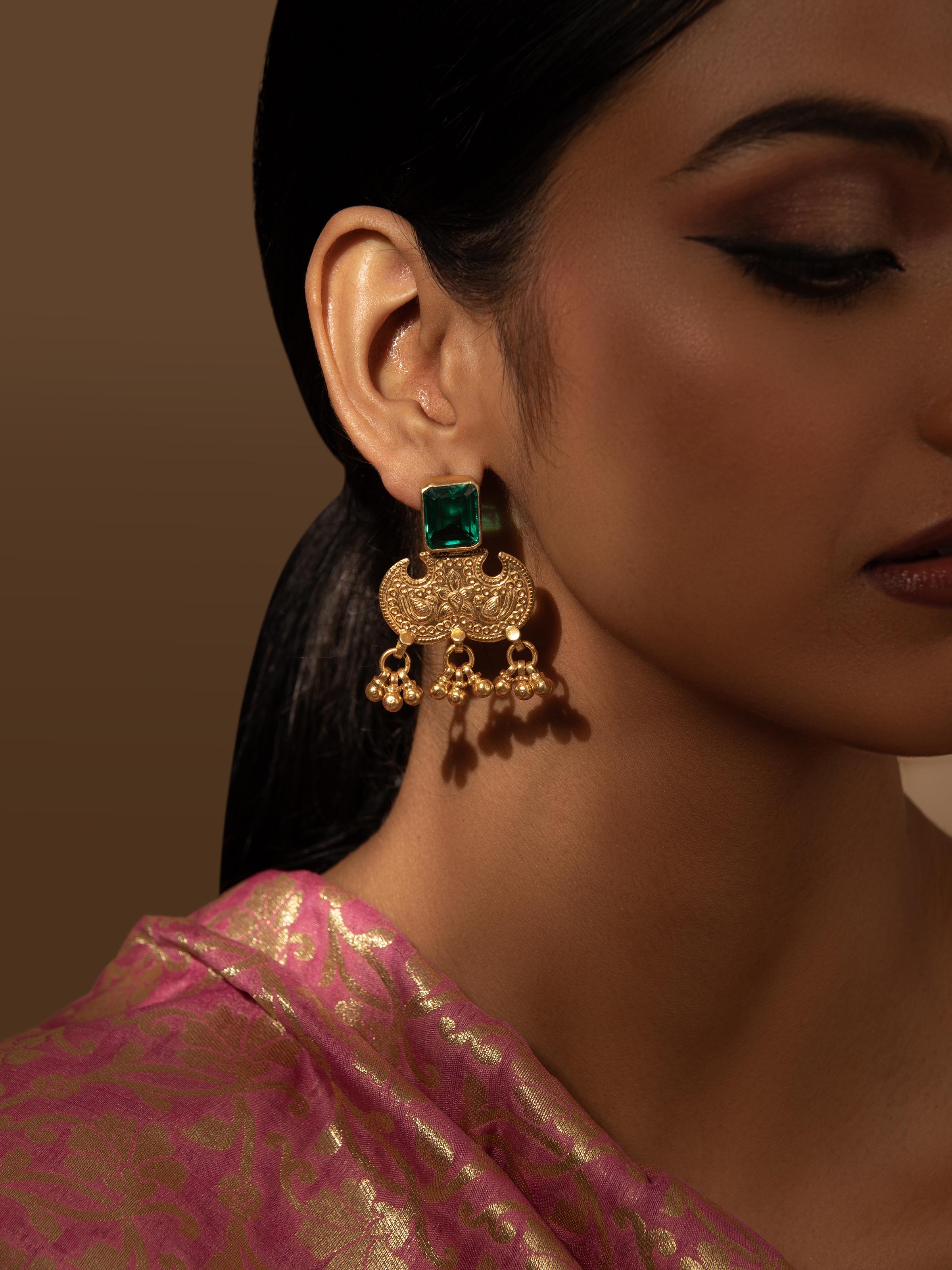 Close-up view of Silver Smithing Drop Earrings emphasizing the intricate silver detailing and design.