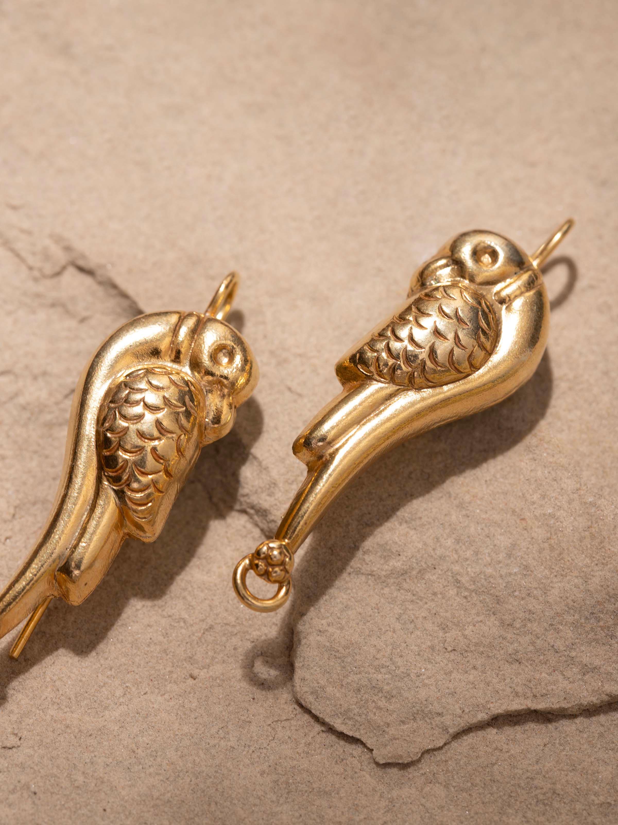 Angled view of Silver Smithing Drop Earrings displaying their elegant drop and detailed design